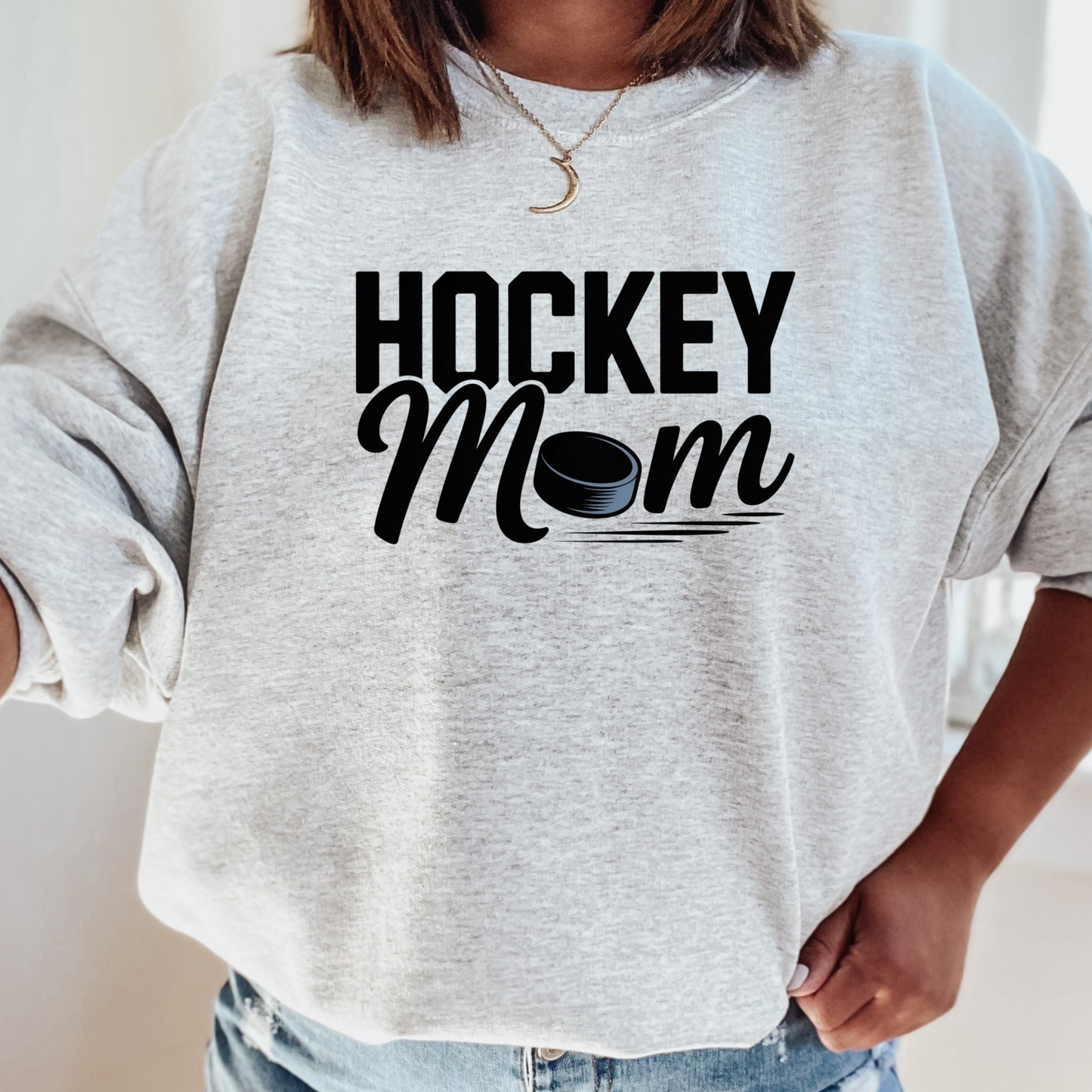 Hockey Mom crewneck sweatshirt with bold hockey-inspired text on a cozy unisex sweatshirt. hockey mom crewneck, hockey mom sweatshirt, hockey parent apparel, sports mom sweatshirt, cozy hockey shirt, hockey family clothing, game day sweatshirt, proud hockey mom, rink side style, unisex crewneck, hockey life apparel, mom gift sweatshirt