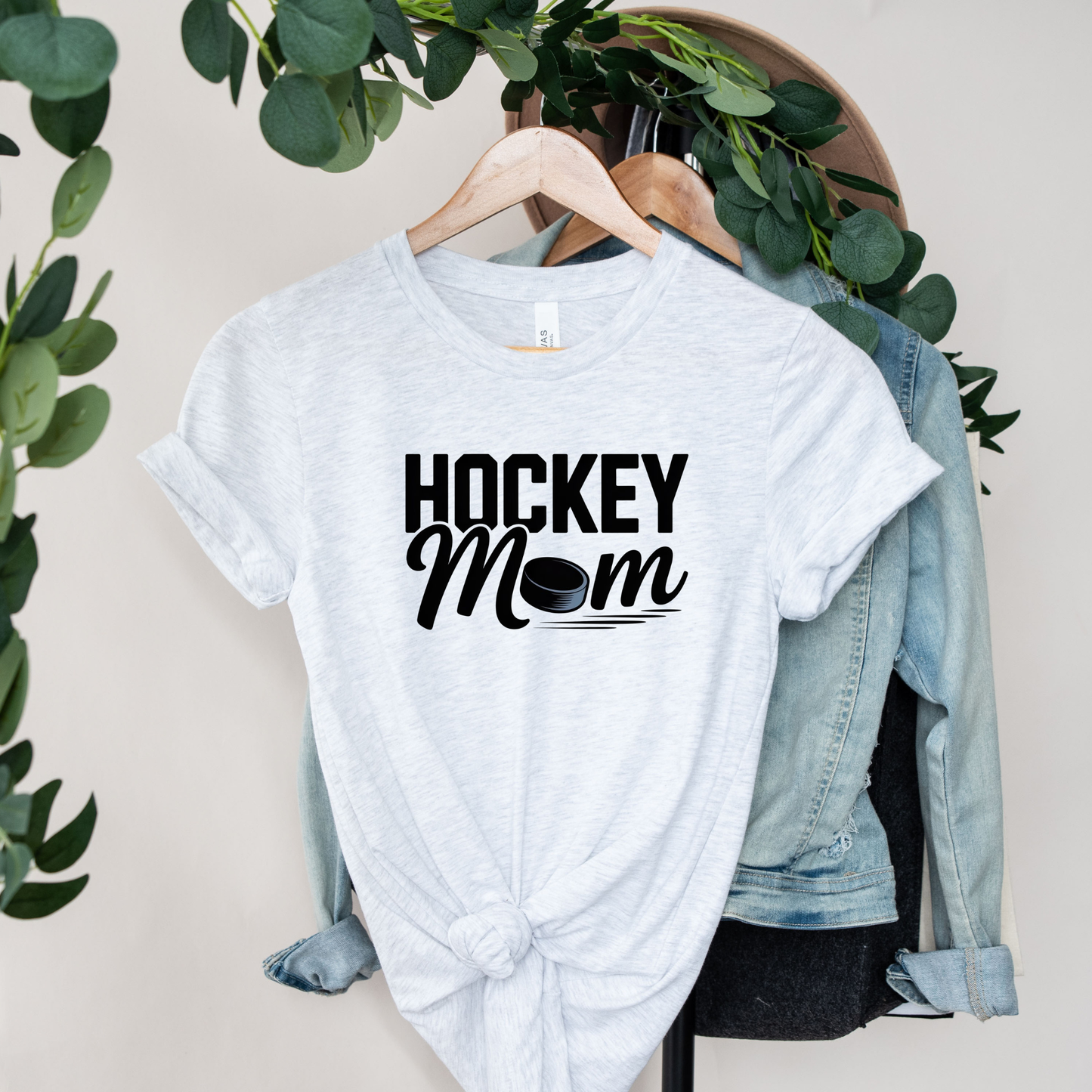 Hockey Mom shirt with a hockey puck graphic on a unisex graphic tee. hockey mom shirt, hockey parent tee, sports mom shirt, unisex graphic tee, hockey fan apparel, game day shirt, hockey life shirt, funny mom shirt, puck shirt, tournament shirt, practice shirt, mom gift tee, hockey family apparel, everyday casual tee, proud hockey mom