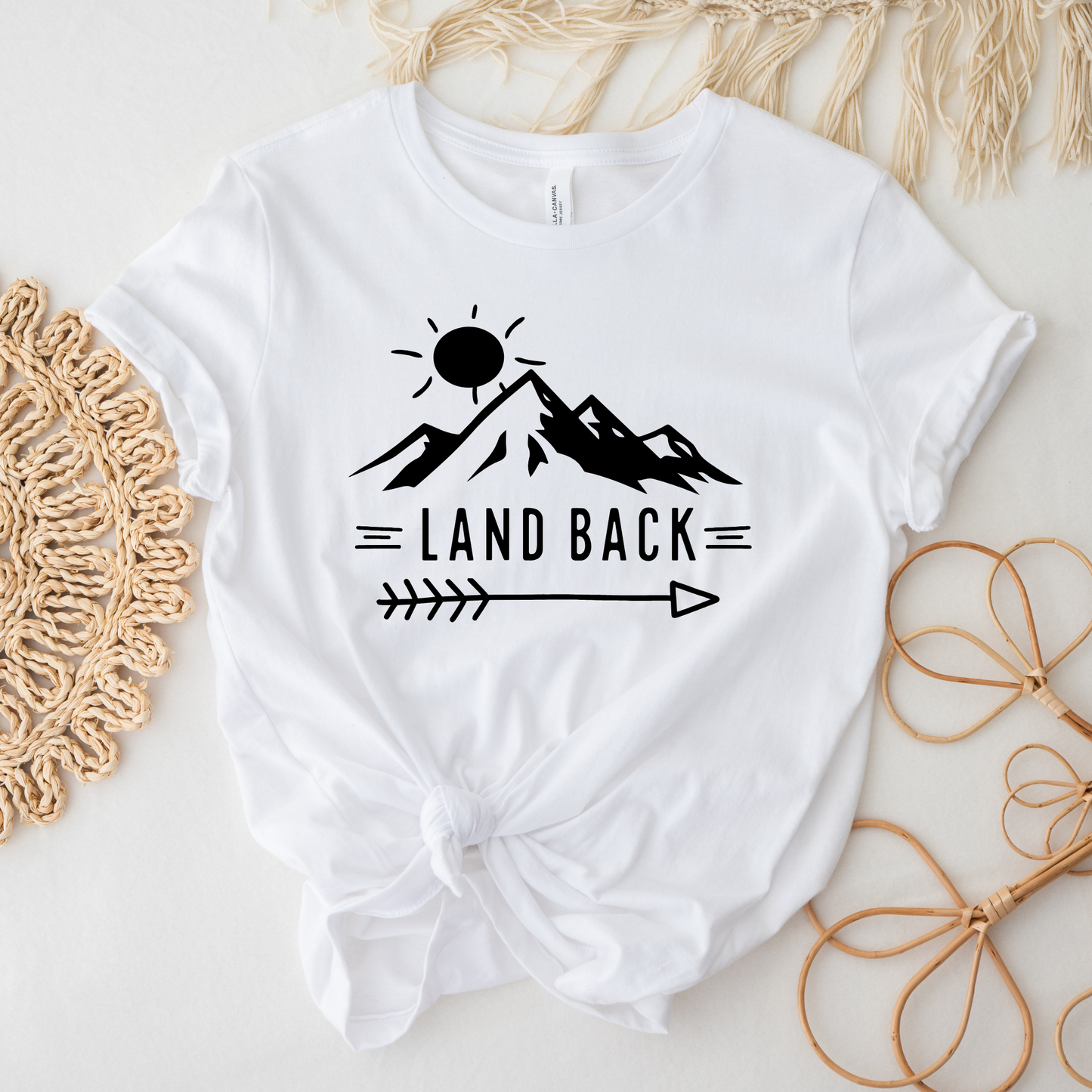 Land Back unisex t-shirt featuring original mountain and sun graphic design symbolizing Indigenous land return movement on soft comfortable cotton tee, perfect for activists and allies.