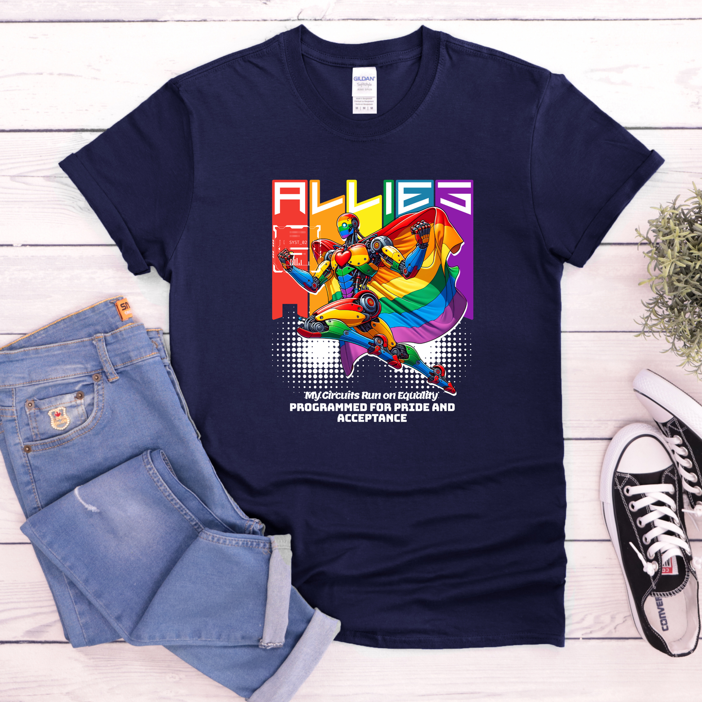 Navy blue t-shirt with colorful graphic and text on a wooden surface with jeans and sneakers. allies robot shirt, pride shirt, ally shirt, LGBTQ support tee, rainbow graphic tee, equality shirt, acceptance shirt, unisex graphic tee, pride apparel, colorful robot shirt, statement tee, allyship apparel, inclusive fashion, fun pride shirt, rainbow ally shirt