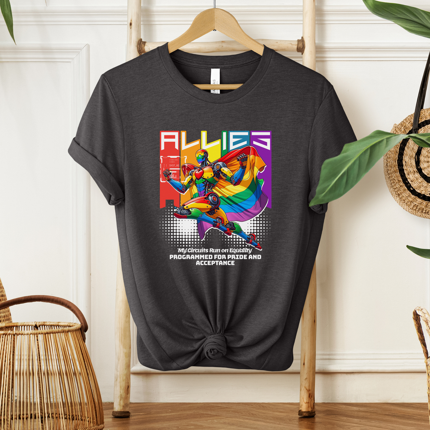 Black t-shirt with colorful graphic design on a wooden hanger against a white wall. allies robot shirt, pride shirt, ally shirt, LGBTQ support tee, rainbow graphic tee, equality shirt, acceptance shirt, unisex graphic tee, pride apparel, colorful robot shirt, statement tee, allyship apparel, inclusive fashion, fun pride shirt, rainbow ally shirt