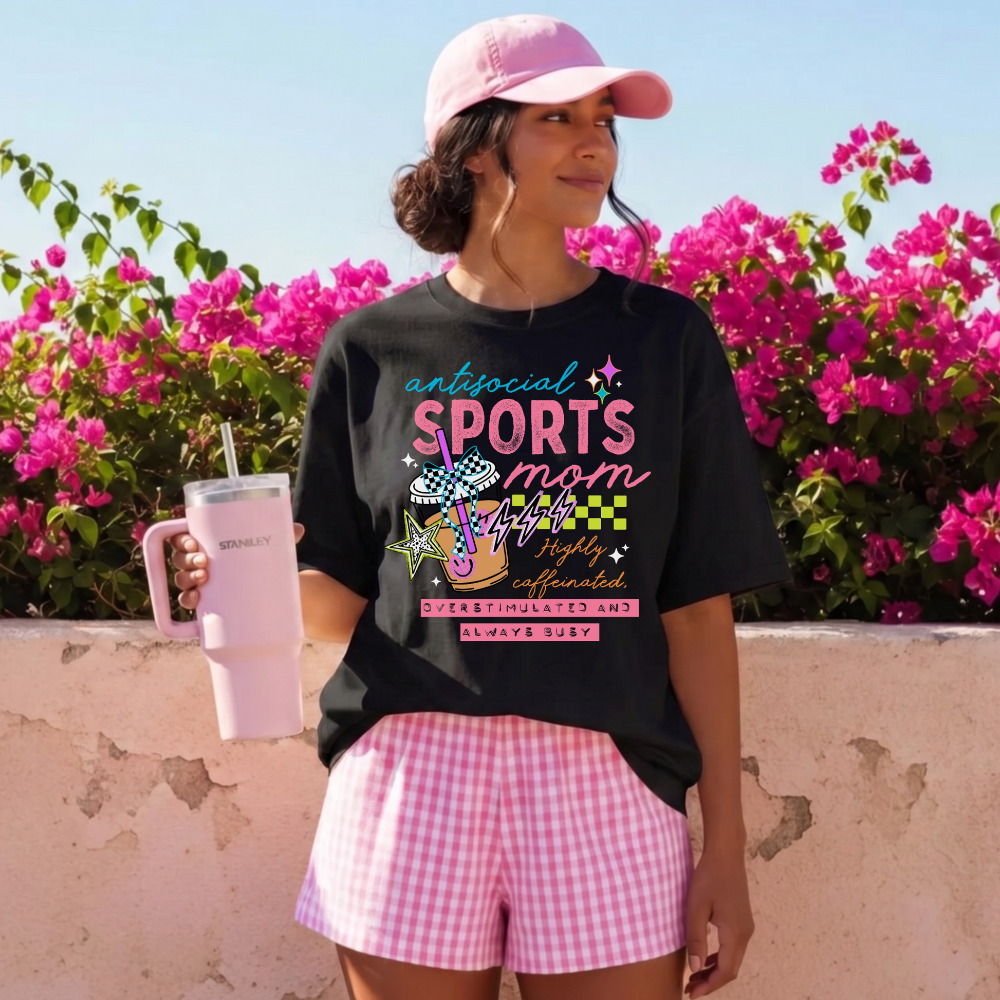 Antisocial Sports Mom Highly Caffeinated Overstimulated And Always Busy shirt with colorful sporty graphic on a unisex tee. antisocial sports mom, sports mom shirt, funny mom tee, caffeinated mom shirt, busy mom apparel, unisex graphic tee, overstimulated mom shirt, sideline mom shirt, coffee mom shirt, statement tee, mom life shirt, everyday casual tee, gift for sports mom, humorous mom shirt, colorful graphic tee