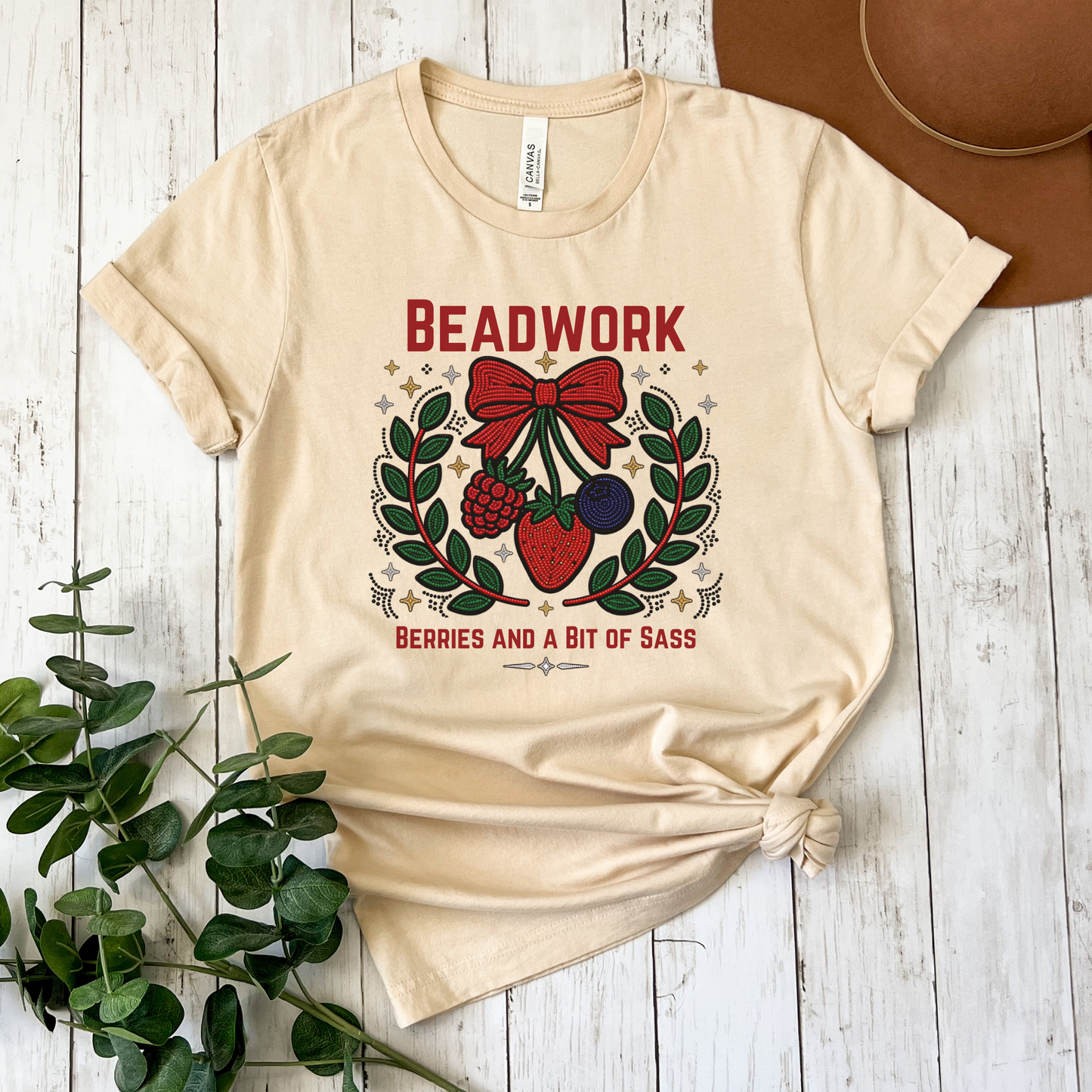 Show your love for Indigenous artistry with our Beadwork, Berries & A Bit of Sass shirt. Featuring a vibrant beadwork-inspired berry design, this soft unisex tee is perfect for powwows, markets, and everyday wear. beadwork shirt, Indigenous beadwork shirt, berry graphic tee, Indigenous fashion, beaded berry shirt, woodland inspired apparel, Indigenous artist shirt, powwow clothing, Indigenous pride shirt, Native inspired graphic tee, strawberry beadwork design, Indigenous gifts, cultural apparel, Indigenous