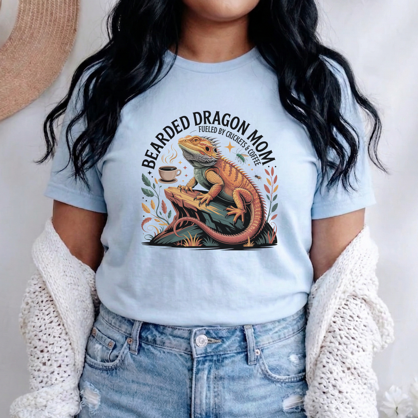 Bearded Dragon Mom Fueled By Crickets and Coffee Shirt featuring a detailed bearded dragon illustration, coffee cup, crickets, and botanical accents. bearded dragon mom shirt, reptile mom shirt, bearded dragon shirt, beardie mom tee, reptile lover shirt, exotic pet shirt, coffee lover shirt, bearded dragon gift, reptile owner gift, lizard shirt, reptile apparel, beardie owner shirt, crickets and coffee shirt, exotic animal lover, pet mom shirt, reptile enthusiast gift, dragon mom shirt, reptile keeper shirt
