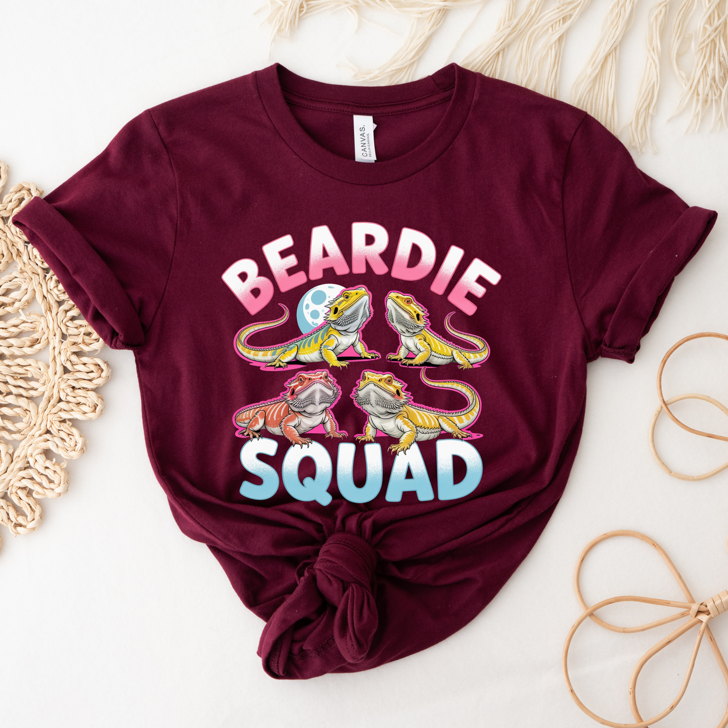 Beardie Squad shirt with colorful bearded dragon graphic and bold text on a unisex tee. beardie squad, bearded dragon shirt, reptile lover shirt, funny animal tee, pet lover shirt, unisex graphic tee, beardie mom, beardie dad, reptile enthusiast, colorful graphic shirt, cute animal shirt, gift for reptile lover, bearded dragon apparel, statement tee, animal lover clothing