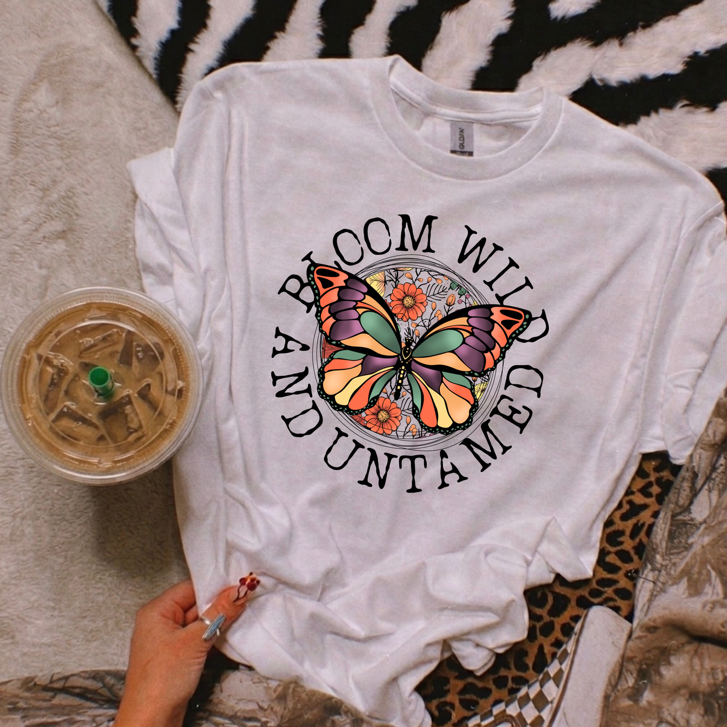 Bloom Wild And Untamed Butterfly shirt with butterfly graphic and inspirational text on a unisex tee. bloom wild and untamed, butterfly shirt, inspirational shirt, nature graphic tee, unisex t shirt, floral butterfly shirt, free spirit shirt, statement tee, everyday graphic tee, gift idea shirt, uplifting apparel, feminine butterfly tee