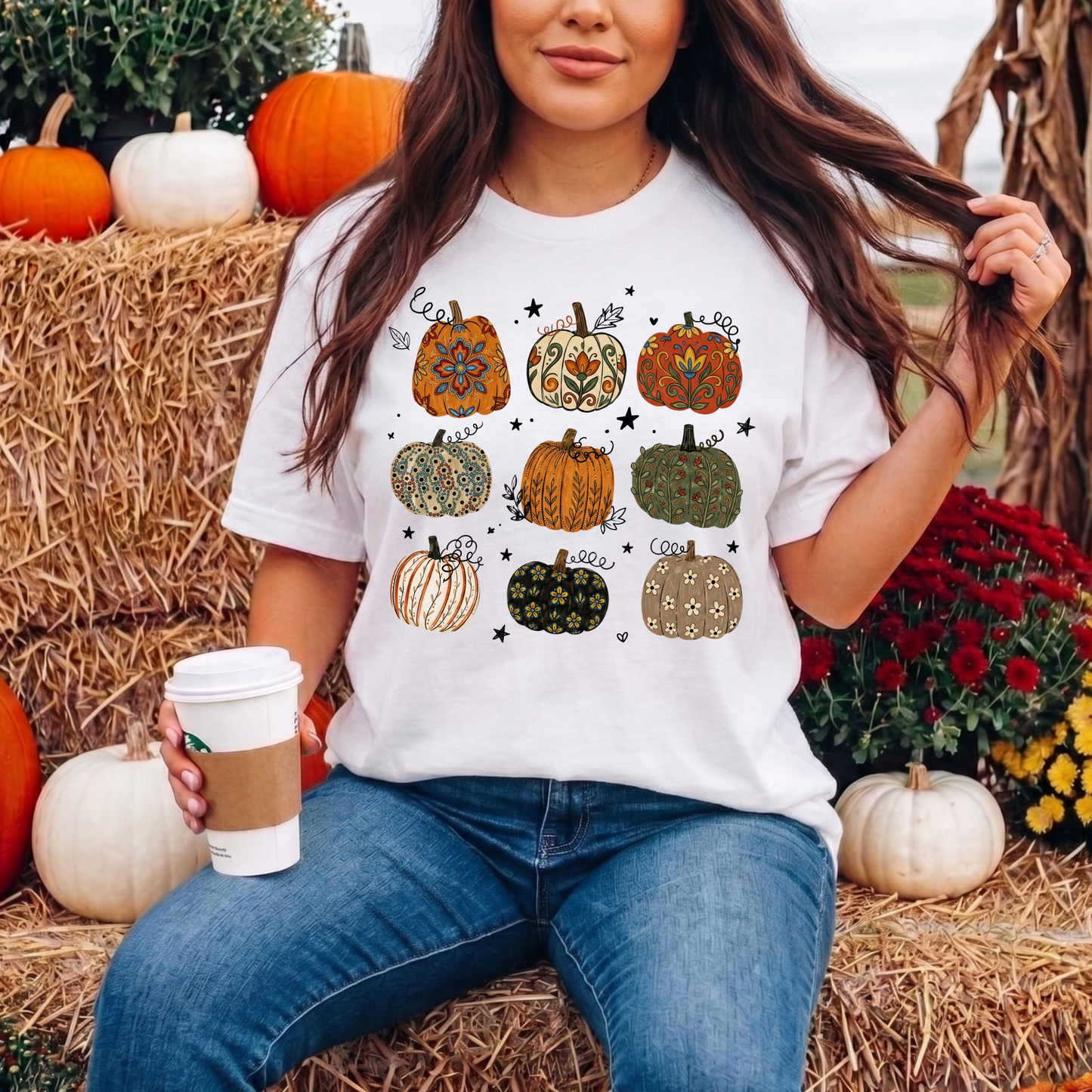 t-shirt featuring nine decorative pumpkins with Indigenous-inspired floral and botanical patterns in warm autumn colors arranged in a grid. indigenous pumpkin shirt, boho pumpkin shirt, fall pumpkin shirt, autumn graphic tee, thanksgiving shirt, indigenous inspired shirt, floral pumpkin shirt, woodland fall shirt, pumpkin patch outfit, harvest shirt, boho fall fashion, cozy autumn tee, fall aesthetic shirt, pumpkin lover gift, autumn apparel, cottagecore fall shirt, botanical pumpkin shirt