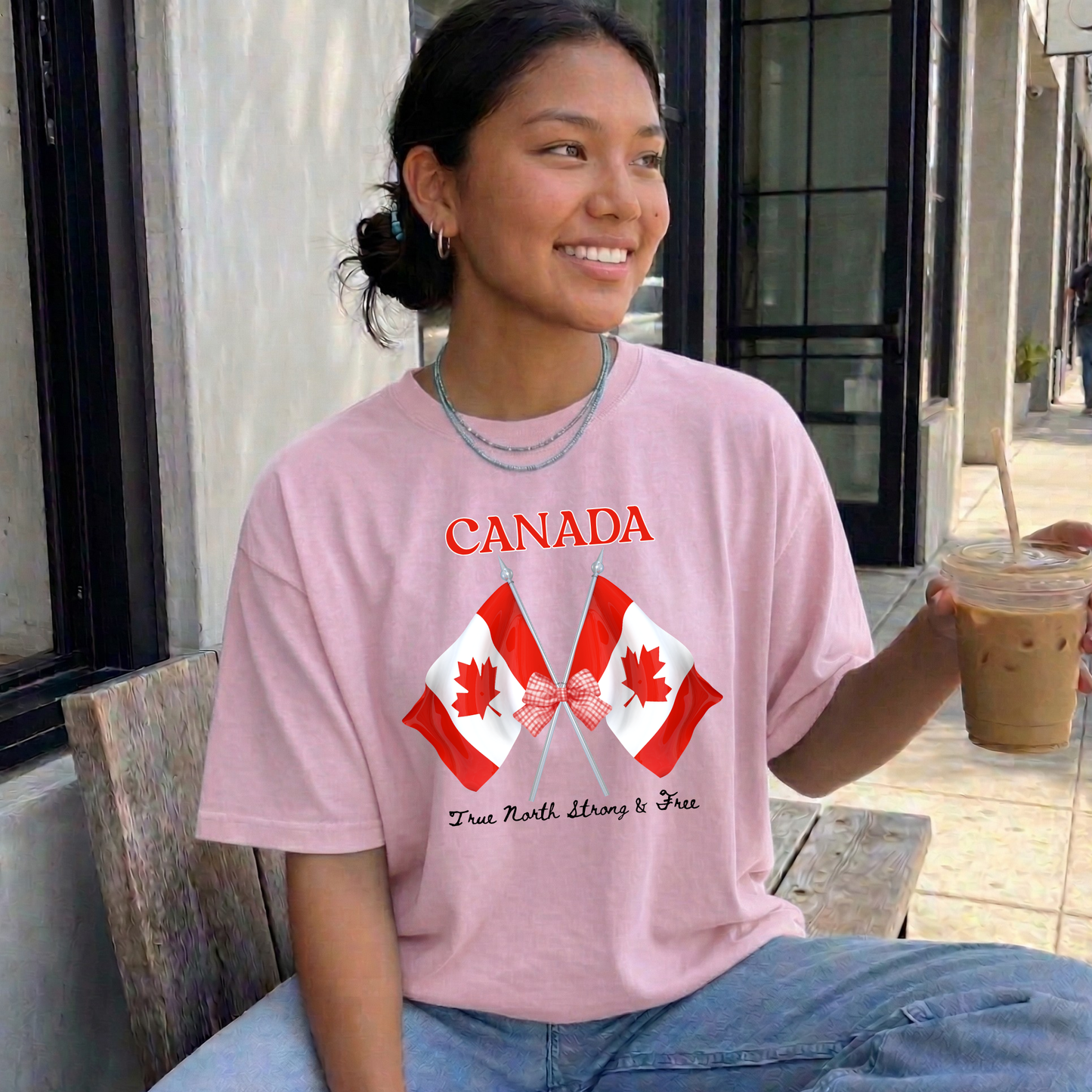 Canada Day Flag Coquette Bow True North Strong and Free Shirt featuring two Canadian flags with a red gingham bow and patriotic Canadian design. canada day shirt, canada shirt, canadian pride shirt, true north strong and free, coquette bow shirt, canada flag shirt, patriotic canada shirt, canada day outfit, canada day apparel, gingham bow shirt, july 1st shirt, canadian clothing, red bow shirt, canada celebration shirt, canadian gift, cute canada shirt, canada day tee, canada flag bow, canada coquette shirt