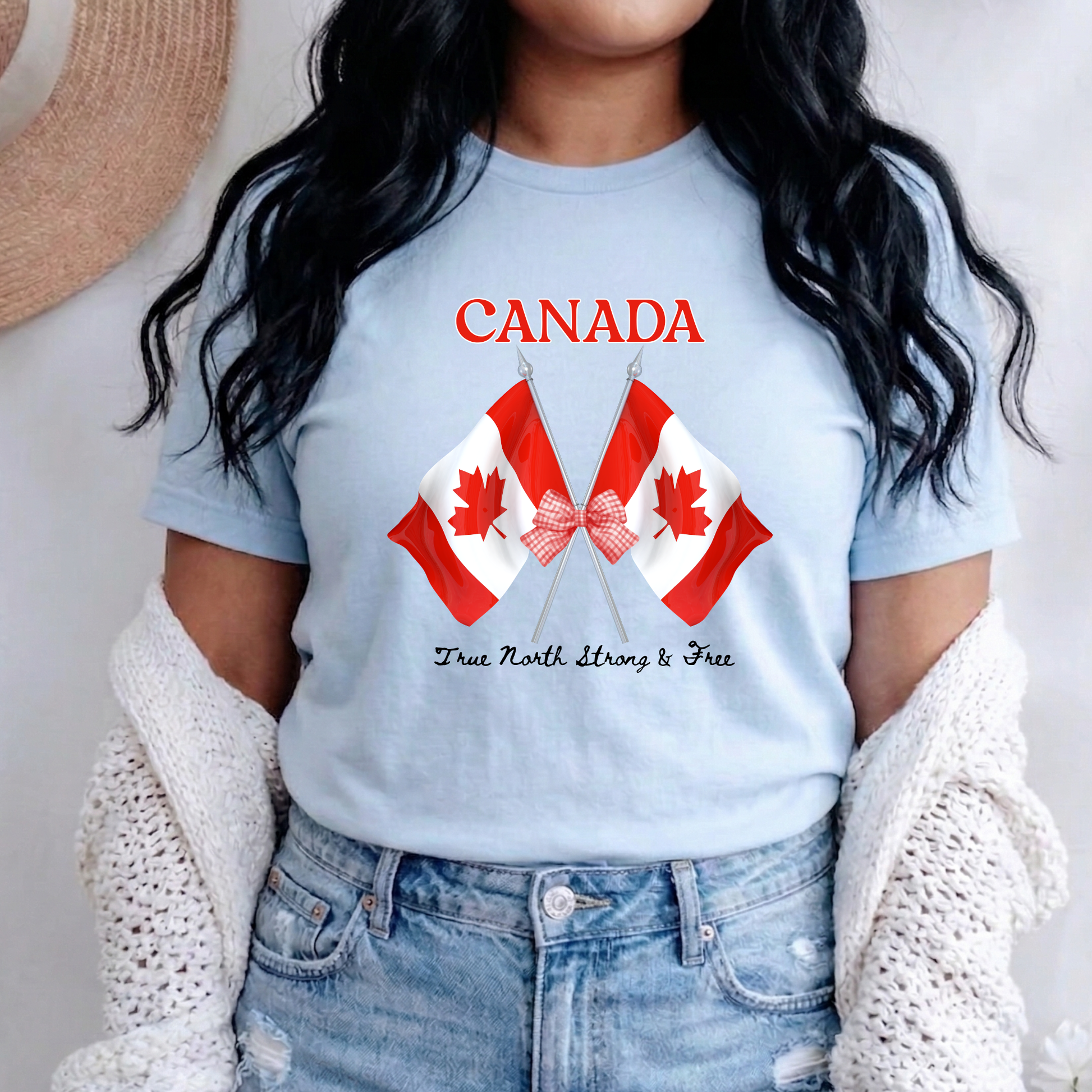 Canada Day Flag Coquette Bow True North Strong and Free Shirt featuring two Canadian flags with a red gingham bow and patriotic Canadian design. canada day shirt, canada shirt, canadian pride shirt, true north strong and free, coquette bow shirt, canada flag shirt, patriotic canada shirt, canada day outfit, canada day apparel, gingham bow shirt, july 1st shirt, canadian clothing, red bow shirt, canada celebration shirt, canadian gift, cute canada shirt, canada day tee, canada flag bow, canada coquette shirt