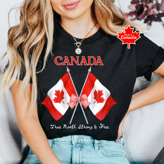 Canada Day Flag Coquette Bow True North Strong and Free Shirt featuring two Canadian flags with a red gingham bow and patriotic Canadian design. canada day shirt, canada shirt, canadian pride shirt, true north strong and free, coquette bow shirt, canada flag shirt, patriotic canada shirt, canada day outfit, canada day apparel, gingham bow shirt, july 1st shirt, canadian clothing, red bow shirt, canada celebration shirt, canadian gift, cute canada shirt, canada day tee, canada flag bow, canada coquette shirt
