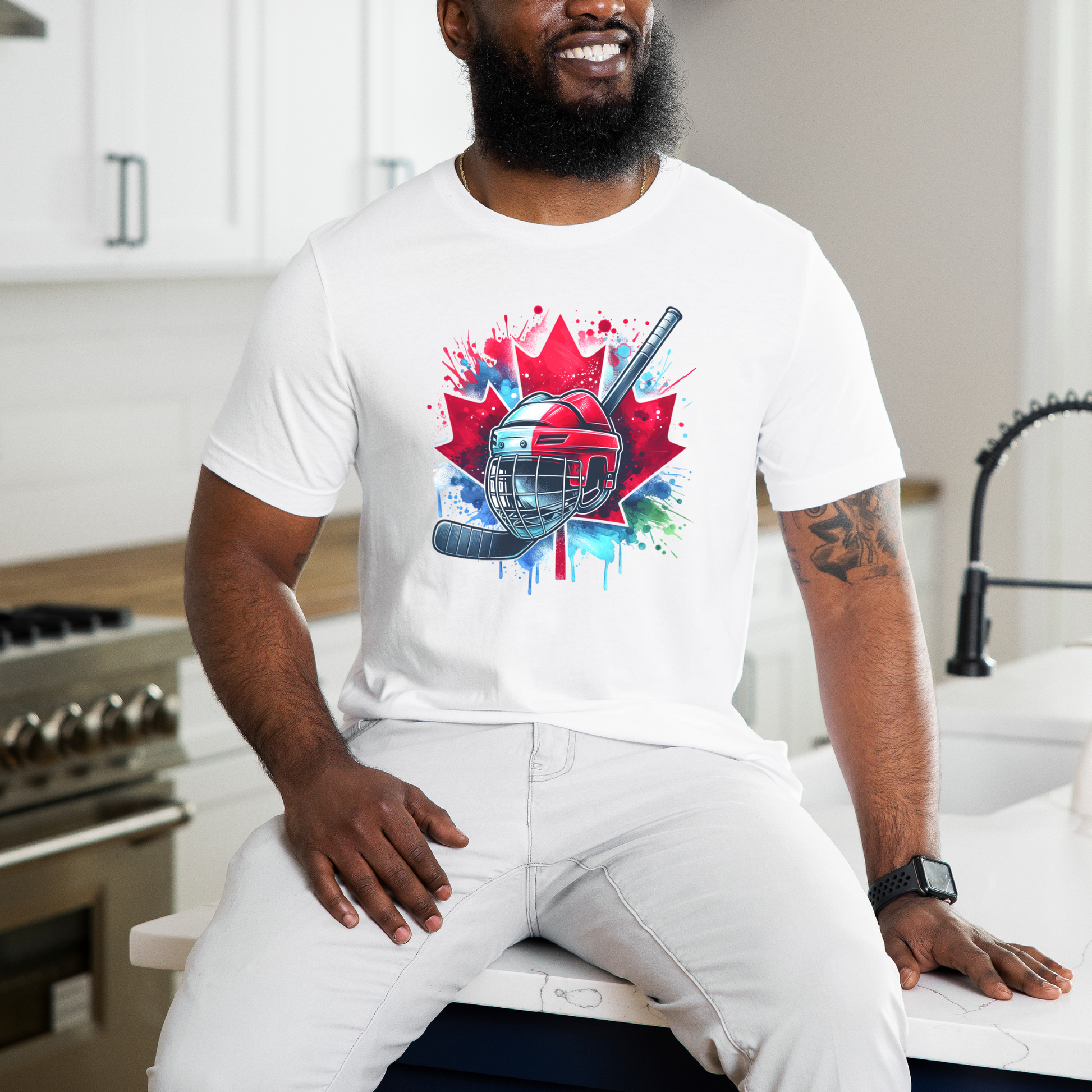 Canada Hockey Shirt featuring a colorful hockey helmet and stick graphic layered over a vibrant red Canadian maple leaf with paint splash accents. Proudly made in Canada, this patriotic hockey t-shirt is perfect for hockey fans, players, coaches, and Canada Day celebrations.