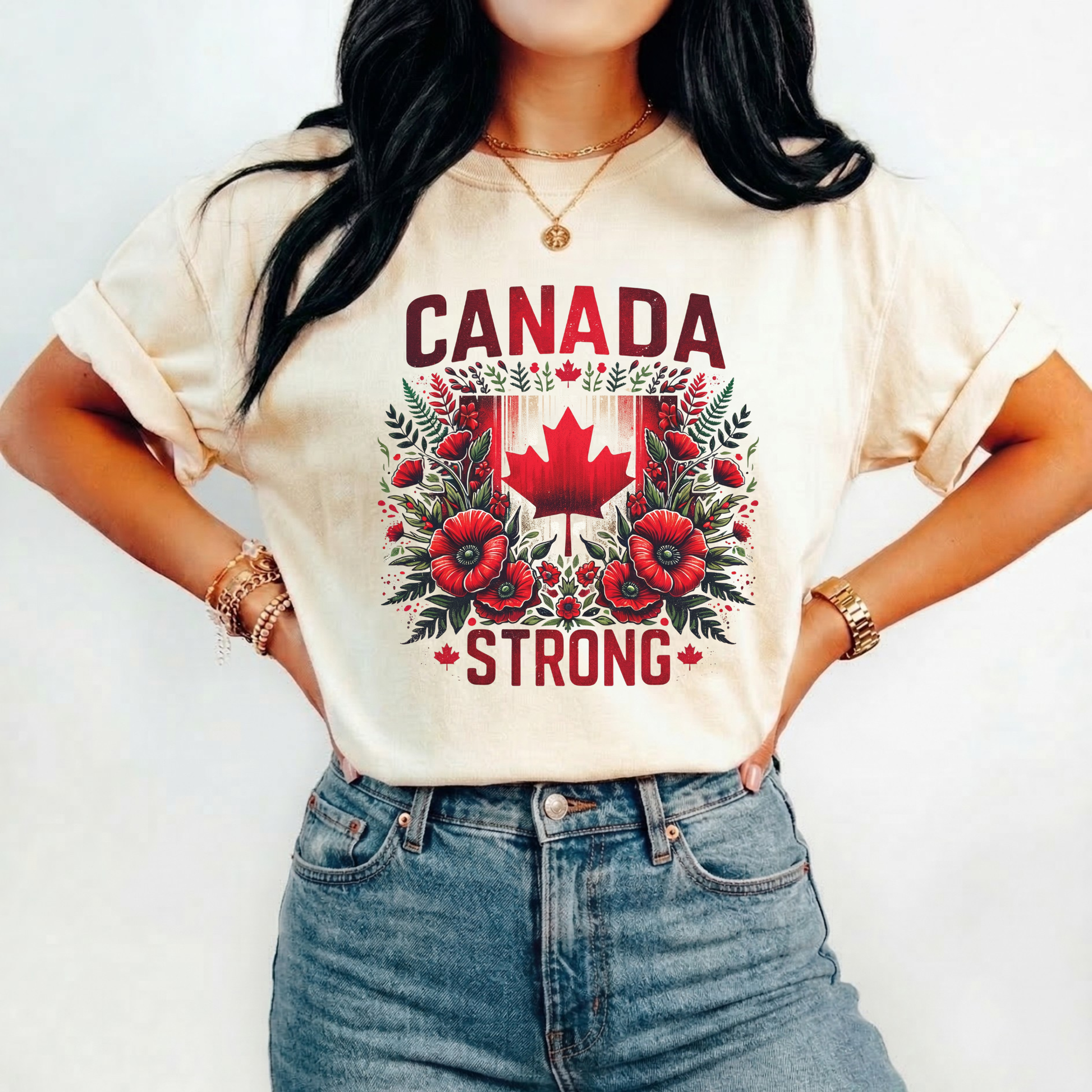 Canada Strong shirt featuring a red Canadian maple leaf surrounded by vibrant red flowers and greenery with bold Canada Strong text. Proudly made in Canada, this patriotic floral graphic tee celebrates Canadian pride, resilience, and unity.