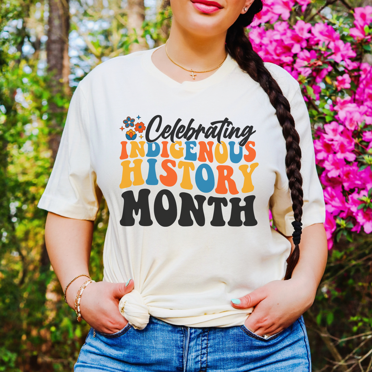 Celebrating Indigenous History Month shirt with colorful text and hand-drawn floral design on a unisex t-shirt. celebrating indigenous history month, indigenous history month shirt, hand drawn florals, sahdeh spruce design, indigenous pride tee, cultural celebration shirt, unisex graphic tee, indigenous apparel, native pride shirt, heritage clothing, meaningful statement tee, everyday wear shirt, community event shirt, indigenous month shirt, floral graphic tee