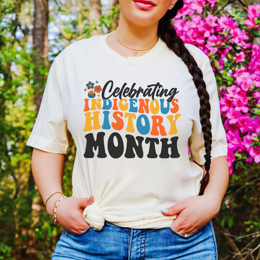 Celebrating Indigenous History Month shirt with colorful text and hand-drawn floral design on a unisex t-shirt. celebrating indigenous history month, indigenous history month shirt, hand drawn florals, sahdeh spruce design, indigenous pride tee, cultural celebration shirt, unisex graphic tee, indigenous apparel, native pride shirt, heritage clothing, meaningful statement tee, everyday wear shirt, community event shirt, indigenous month shirt, floral graphic tee