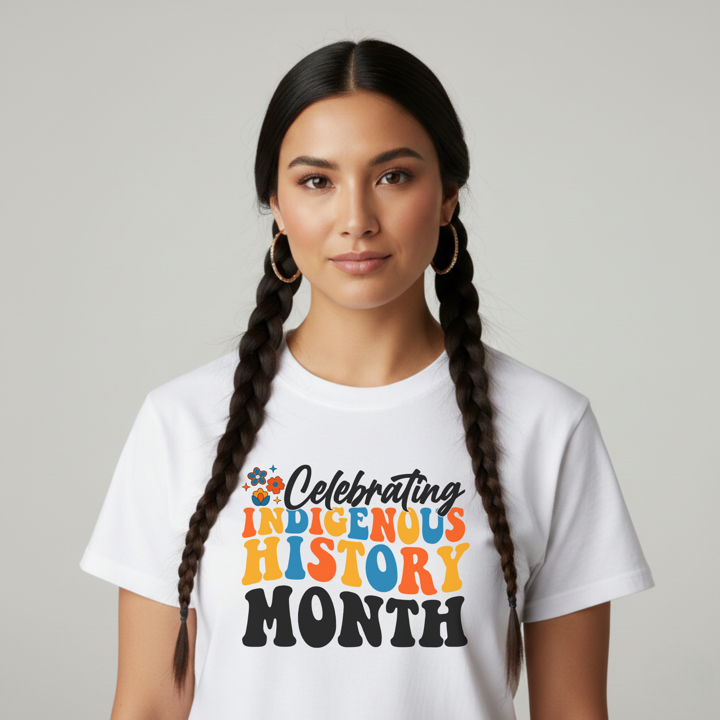 Celebrating Indigenous History Month shirt with colorful text and hand-drawn floral design on a unisex t-shirt. celebrating indigenous history month, indigenous history month shirt, hand drawn florals, sahdeh spruce design, indigenous pride tee, cultural celebration shirt, unisex graphic tee, indigenous apparel, native pride shirt, heritage clothing, meaningful statement tee, everyday wear shirt, community event shirt, indigenous month shirt, floral graphic tee