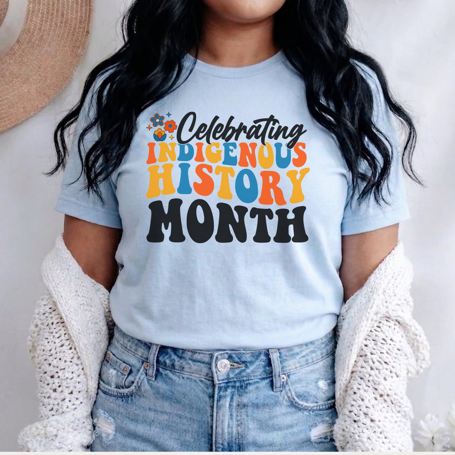 Celebrating Indigenous History Month shirt with colorful text and hand-drawn floral design on a unisex t-shirt. celebrating indigenous history month, indigenous history month shirt, hand drawn florals, sahdeh spruce design, indigenous pride tee, cultural celebration shirt, unisex graphic tee, indigenous apparel, native pride shirt, heritage clothing, meaningful statement tee, everyday wear shirt, community event shirt, indigenous month shirt, floral graphic tee