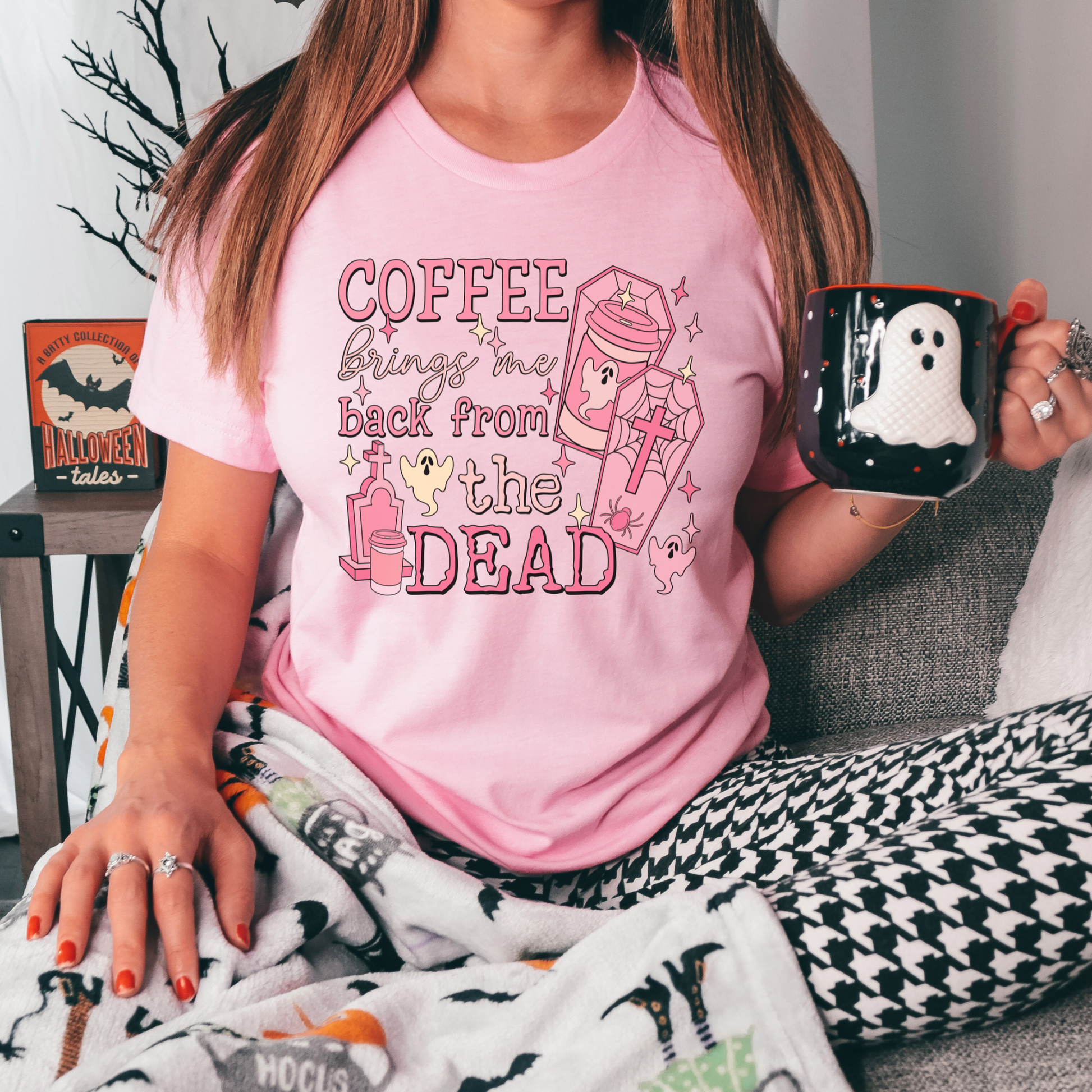 Pink Coffee Brings Me Back From The Dead Shirt featuring cute ghosts, coffee cups, coffins, stars, and spooky aesthetic artwork. coffee shirt, coffee lover shirt, spooky coffee shirt, halloween coffee shirt, ghost shirt, cute ghost shirt, pink halloween shirt, coffee brings me back from the dead, spooky cute shirt, barista shirt, fall shirt, halloween apparel, coffee aesthetic shirt, gothic cute shirt, pink ghost shirt, caffeine lover gift, spooky season shirt, witchy coffee shirt, halloween lover gift