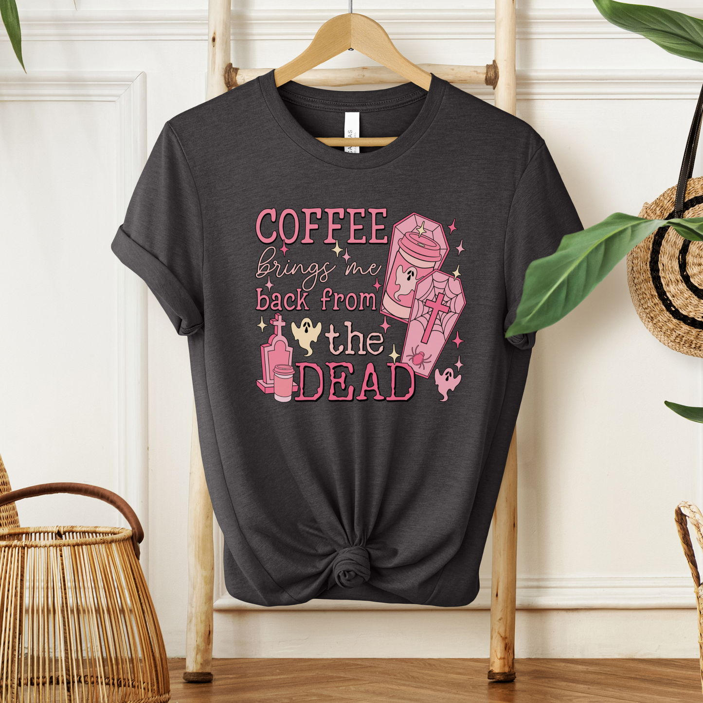 Pink Coffee Brings Me Back From The Dead Shirt featuring cute ghosts, coffee cups, coffins, stars, and spooky aesthetic artwork. coffee shirt, coffee lover shirt, spooky coffee shirt, halloween coffee shirt, ghost shirt, cute ghost shirt, pink halloween shirt, coffee brings me back from the dead, spooky cute shirt, barista shirt, fall shirt, halloween apparel, coffee aesthetic shirt, gothic cute shirt, pink ghost shirt, caffeine lover gift, spooky season shirt, witchy coffee shirt, halloween lover gift