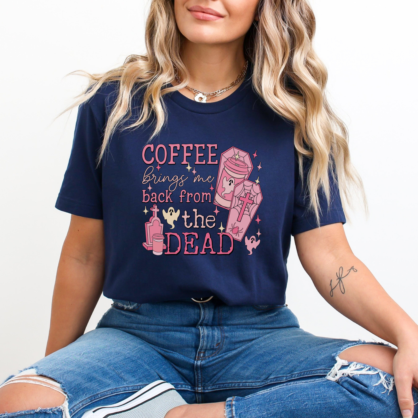 Pink Coffee Brings Me Back From The Dead Shirt featuring cute ghosts, coffee cups, coffins, stars, and spooky aesthetic artwork. coffee shirt, coffee lover shirt, spooky coffee shirt, halloween coffee shirt, ghost shirt, cute ghost shirt, pink halloween shirt, coffee brings me back from the dead, spooky cute shirt, barista shirt, fall shirt, halloween apparel, coffee aesthetic shirt, gothic cute shirt, pink ghost shirt, caffeine lover gift, spooky season shirt, witchy coffee shirt, halloween lover gift