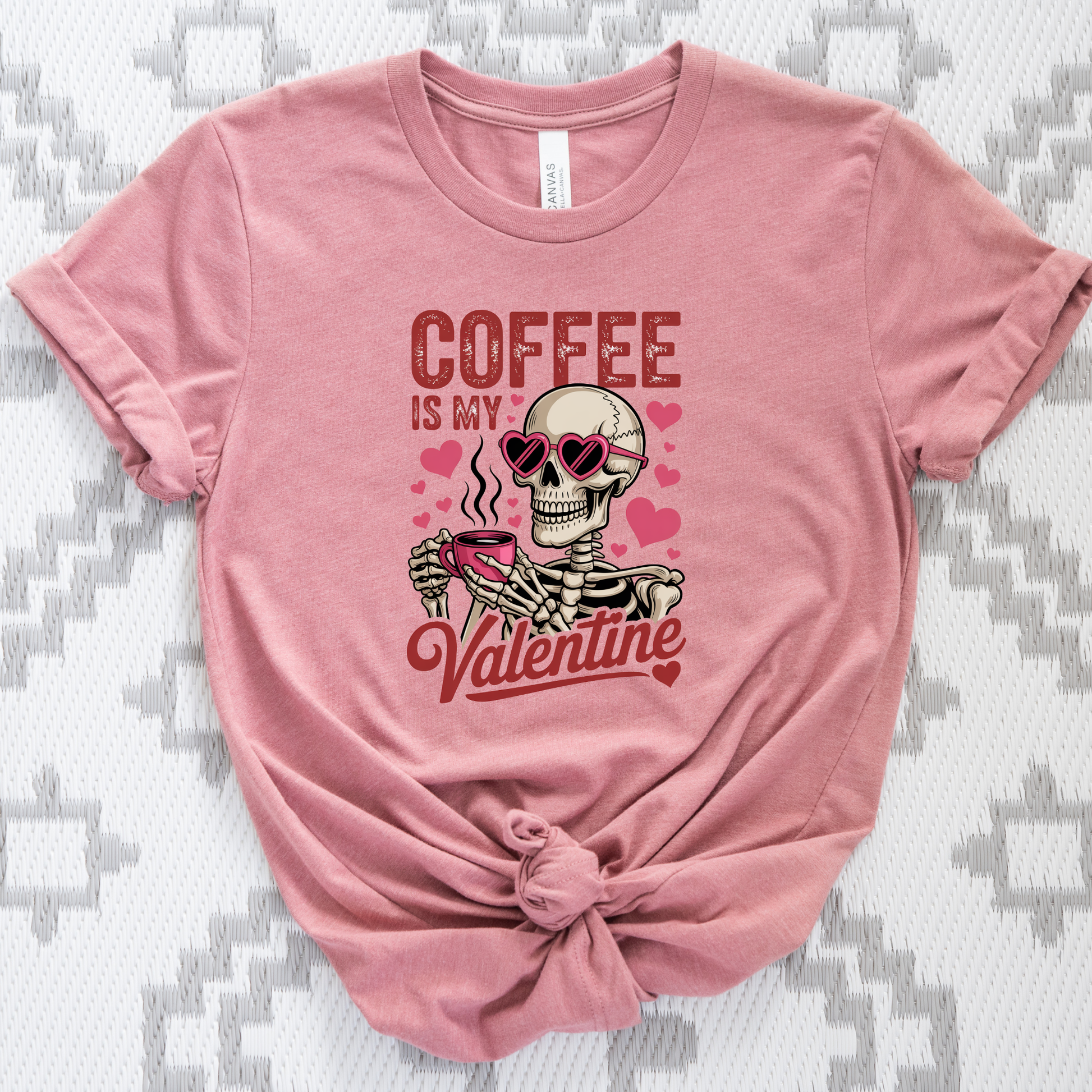 Pink t-shirt with skeleton design and text 'Coffee is my Valentine' on a textured background coffee shirt, coffee lover tee, valentine shirt, funny valentine shirt, coffee is my valentine, cute coffee shirt, unisex graphic tee, caffeine shirt, gift for coffee lover, funny t shirt, casual tee, valentines day shirt