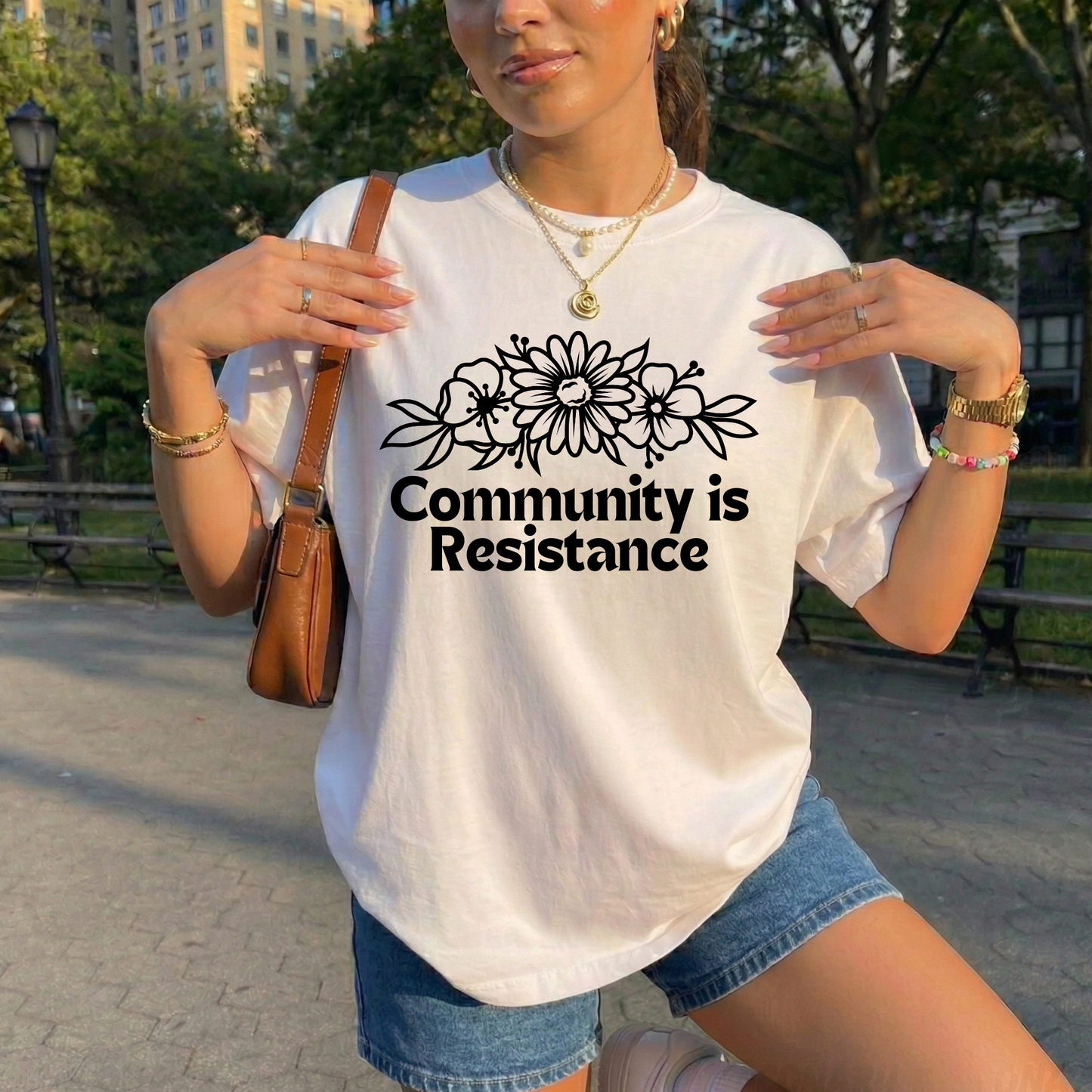 community is resistance shirt, floral resistance graphic tee, community unity floral shirt, resistance floral design t-shirt, activist floral apparel, solidarity floral graphic, community strength floral tee, floral activism shirt, unisex resistance floral top, floral social justice clothing