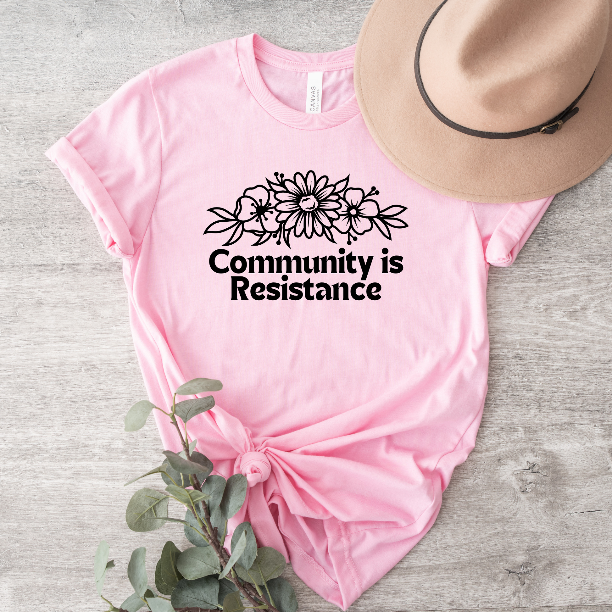 community is resistance shirt, floral resistance graphic tee, community unity floral shirt, resistance floral design t-shirt, activist floral apparel, solidarity floral graphic, community strength floral tee, floral activism shirt, unisex resistance floral top, floral social justice clothing