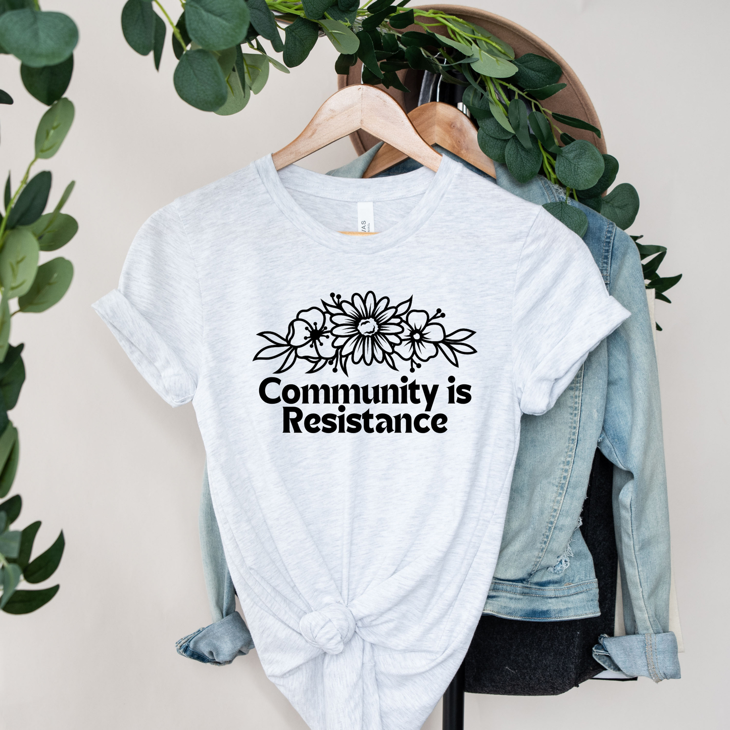 community is resistance shirt, floral resistance graphic tee, community unity floral shirt, resistance floral design t-shirt, activist floral apparel, solidarity floral graphic, community strength floral tee, floral activism shirt, unisex resistance floral top, floral social justice clothing