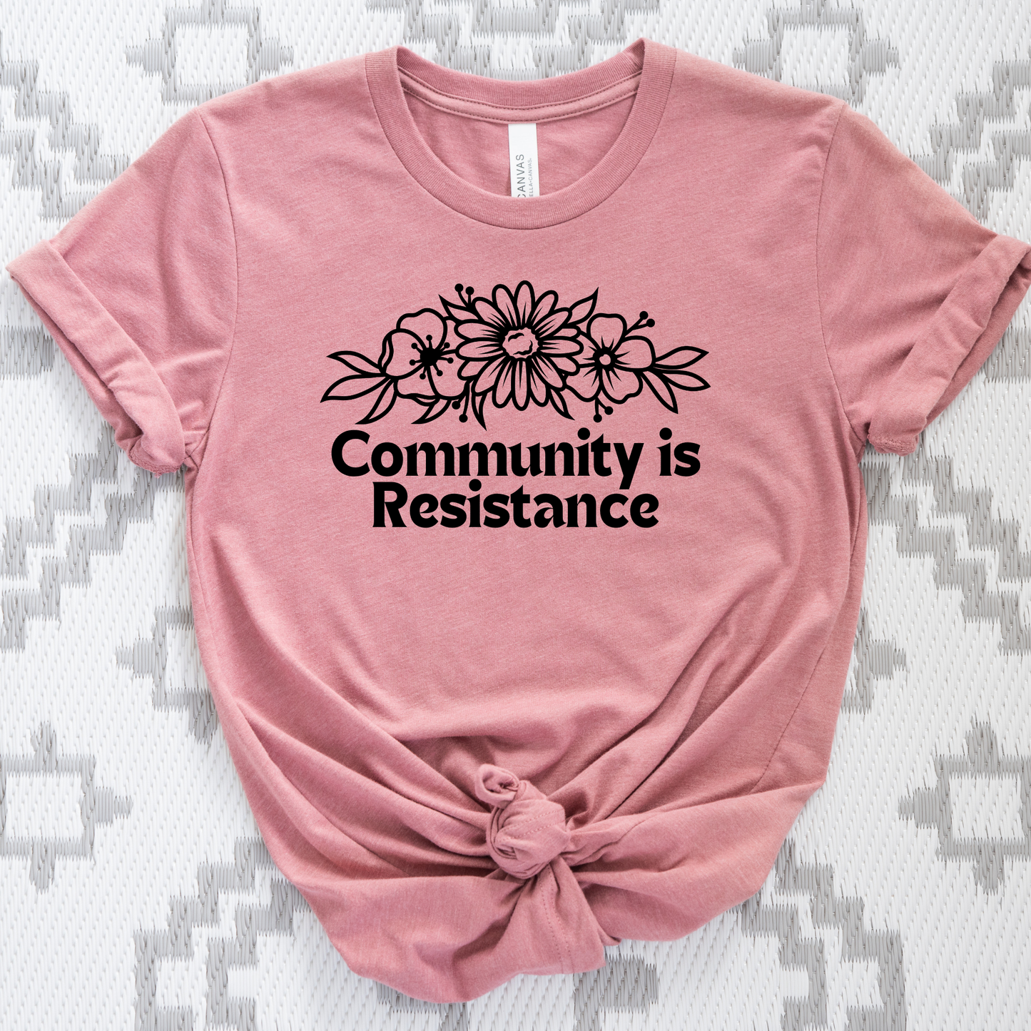 community is resistance shirt, floral resistance graphic tee, community unity floral shirt, resistance floral design t-shirt, activist floral apparel, solidarity floral graphic, community strength floral tee, floral activism shirt, unisex resistance floral top, floral social justice clothing