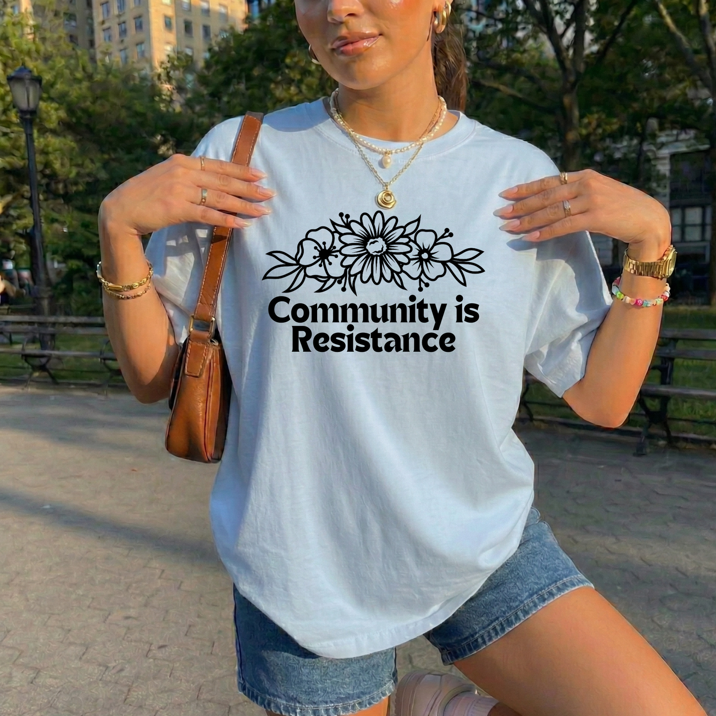 community is resistance shirt, floral resistance graphic tee, community unity floral shirt, resistance floral design t-shirt, activist floral apparel, solidarity floral graphic, community strength floral tee, floral activism shirt, unisex resistance floral top, floral social justice clothing