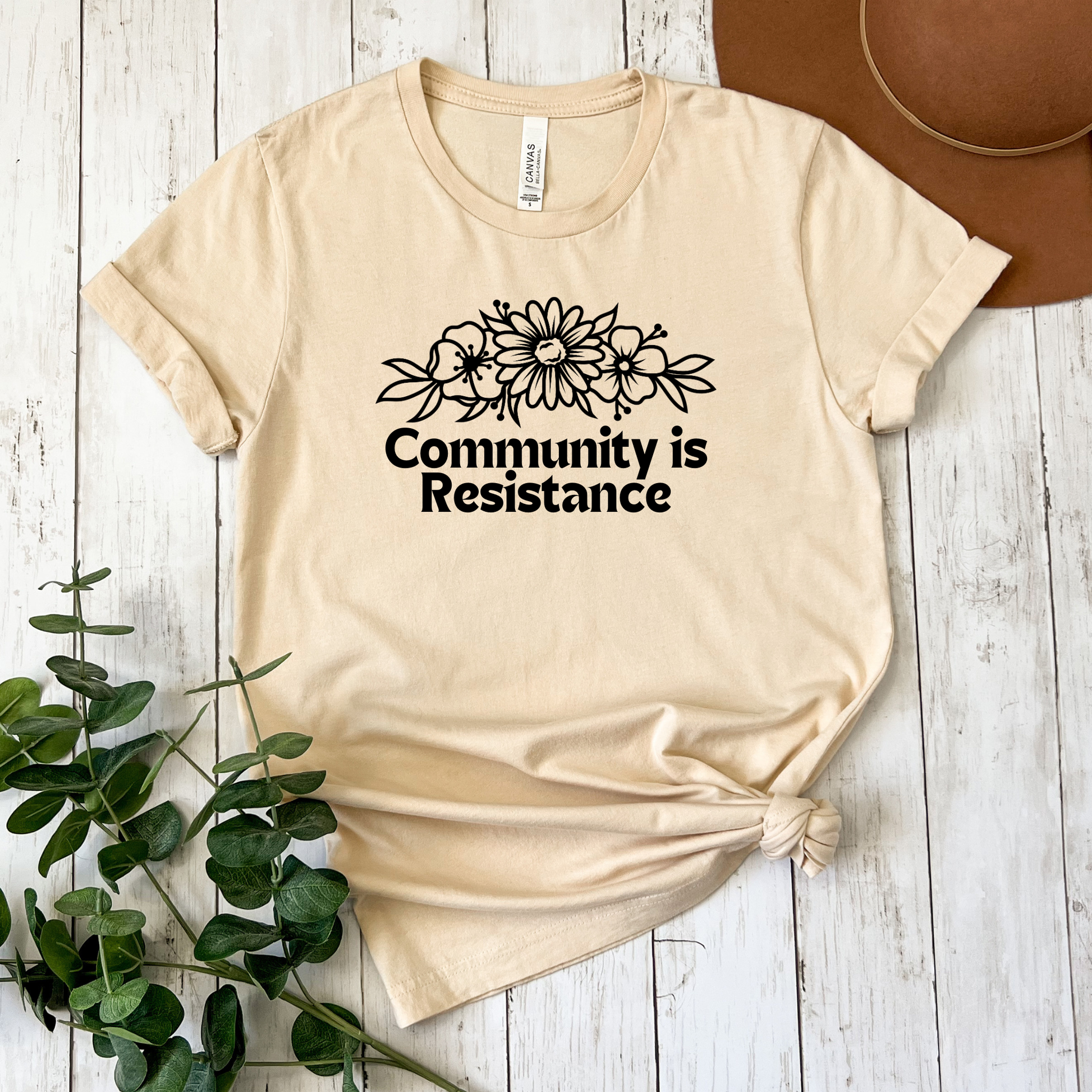 community is resistance shirt, floral resistance graphic tee, community unity floral shirt, resistance floral design t-shirt, activist floral apparel, solidarity floral graphic, community strength floral tee, floral activism shirt, unisex resistance floral top, floral social justice clothing