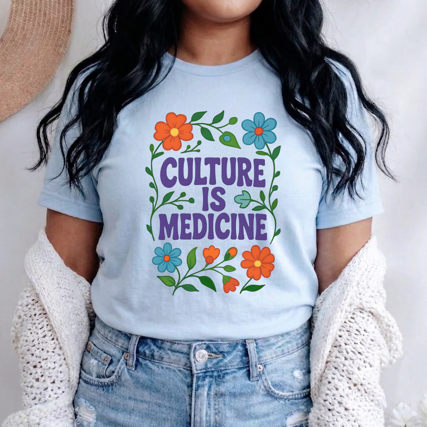 Culture Is Medicine Shirt featuring colorful floral artwork surrounding bold purple lettering. culture is medicine shirt, indigenous shirt, indigenous pride shirt, indigenous apparel, native pride shirt, cultural pride shirt, indigenous history month, national indigenous peoples day, floral shirt, indigenous gift, cultural connection shirt, indigenous woman shirt, reconciliation shirt, indigenous awareness, community shirt, native apparel, indigenous fashion, cultural healing shirt, floral graphic tee