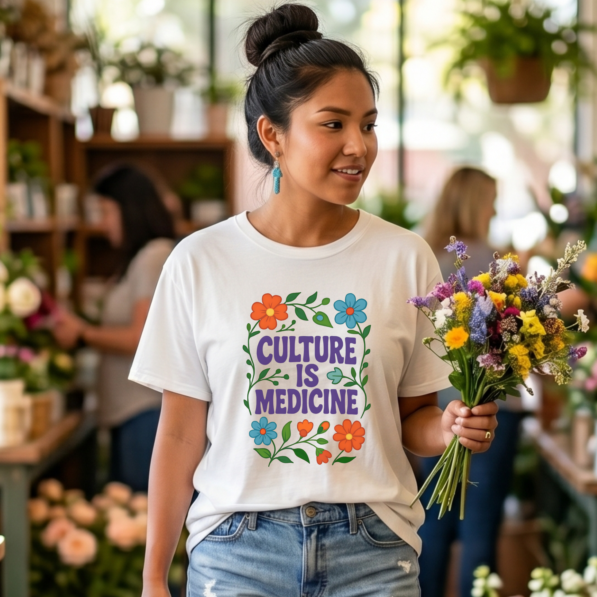 Culture Is Medicine Shirt featuring colorful floral artwork surrounding bold purple lettering. culture is medicine shirt, indigenous shirt, indigenous pride shirt, indigenous apparel, native pride shirt, cultural pride shirt, indigenous history month, national indigenous peoples day, floral shirt, indigenous gift, cultural connection shirt, indigenous woman shirt, reconciliation shirt, indigenous awareness, community shirt, native apparel, indigenous fashion, cultural healing shirt, floral graphic tee