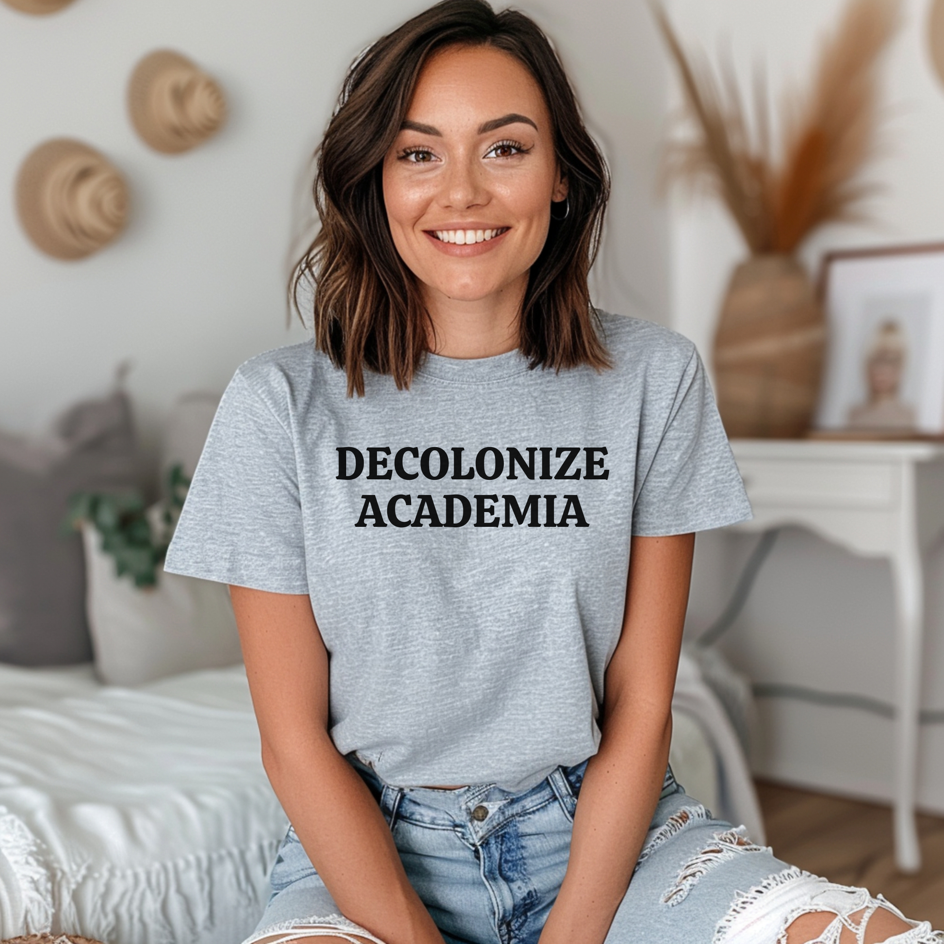 decolonize academia shirt, academic activism shirt, social justice tee, statement graphic tee, unisex protest shirt, educator shirt, student activism apparel, minimalist text shirt, black and white text shirt, inclusive education shirt, campus wear tee, anti colonial shirt, meaningful statement shirt, activism clothing, unisex graphic tee