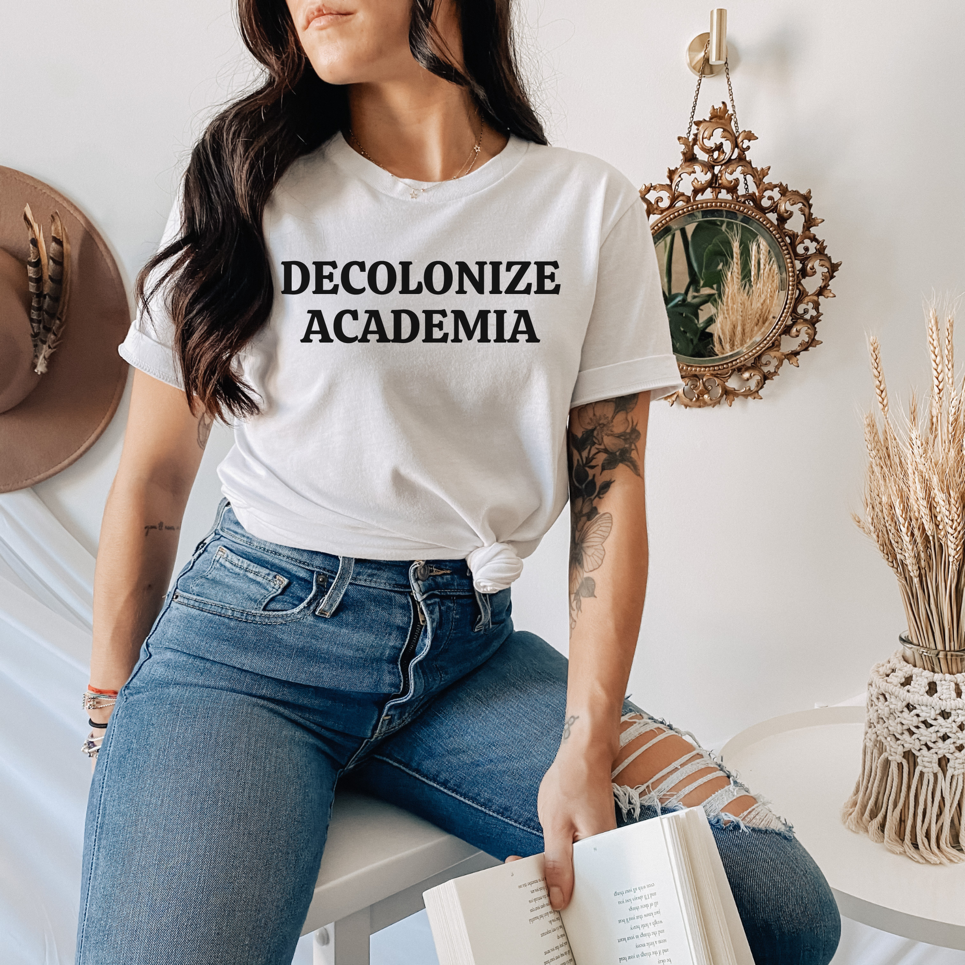 decolonize academia shirt, academic activism shirt, social justice tee, statement graphic tee, unisex protest shirt, educator shirt, student activism apparel, minimalist text shirt, black and white text shirt, inclusive education shirt, campus wear tee, anti colonial shirt, meaningful statement shirt, activism clothing, unisex graphic tee