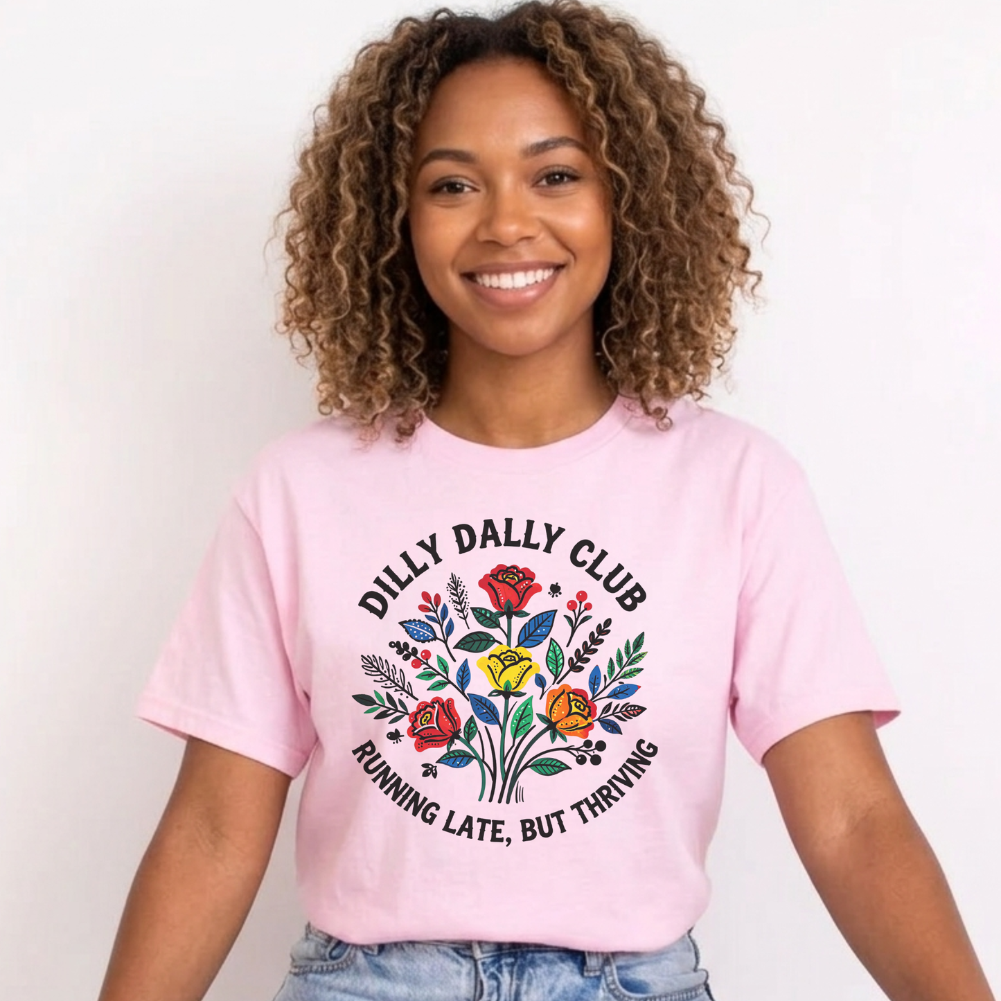 Dilly Dally Club Running Late, But Thriving shirt design featuring colorful woodland-inspired floral artwork with red, yellow, orange, blue, and green flowers arranged in a bouquet. Circular text reads 'Dilly Dally Club' and 'Running Late, But Thriving' on a transparent background. Dilly Dally Club, Running Late But Thriving, Woodland Floral, Floral Shirt, Graphic Tee, Funny Shirt, Unisex Tee, Floral Graphic Tee, Indigenous Inspired, Botanical Shirt, Cottagecore Fashion, Colorful Shirt, Gift For Her