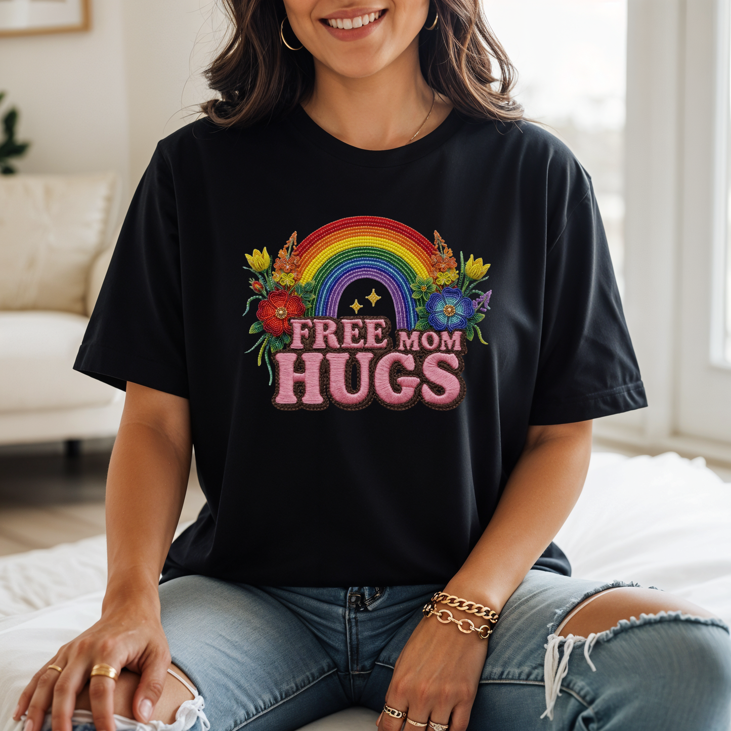 Free Mom Hugs Shirt featuring Indigenous-inspired beaded floral artwork, rainbow design, and pink faux embroidered lettering. free mom hugs shirt, pride shirt, indigenous floral shirt, beaded floral shirt, rainbow pride shirt, lgbtq ally shirt, supportive mom shirt, pride parade shirt, indigenous inspired apparel, faux embroidery shirt, mom hugs shirt, rainbow floral tee, inclusive apparel, pride month shirt, indigenous beadwork design, ally gift, lgbtq support shirt, community love shirt, acceptance shirt