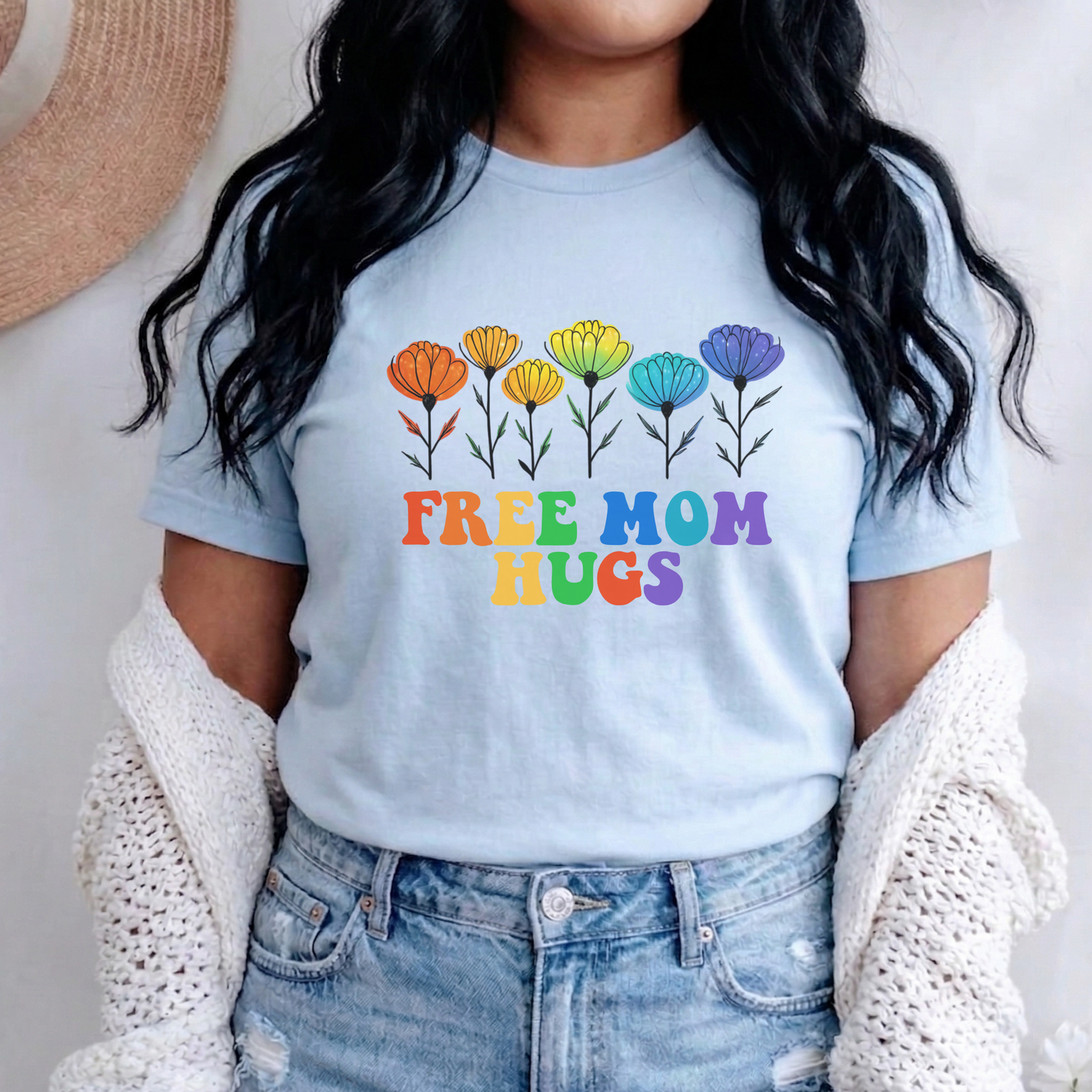 unisex shirt featuring rainbow wildflowers and colourful retro lettering that reads Free Mom Hugs, celebrating LGBTQ2S+ pride, allyship, and inclusion. Free Mom Hugs Shirt, Pride Ally Shirt, LGBTQ2S+ Support Shirt, Rainbow Floral Shirt, Pride Apparel Canada, LGBTQ Ally Tee, Free Hugs Shirt, Rainbow Wildflower Tee, Inclusive Apparel, Pride Month Clothing