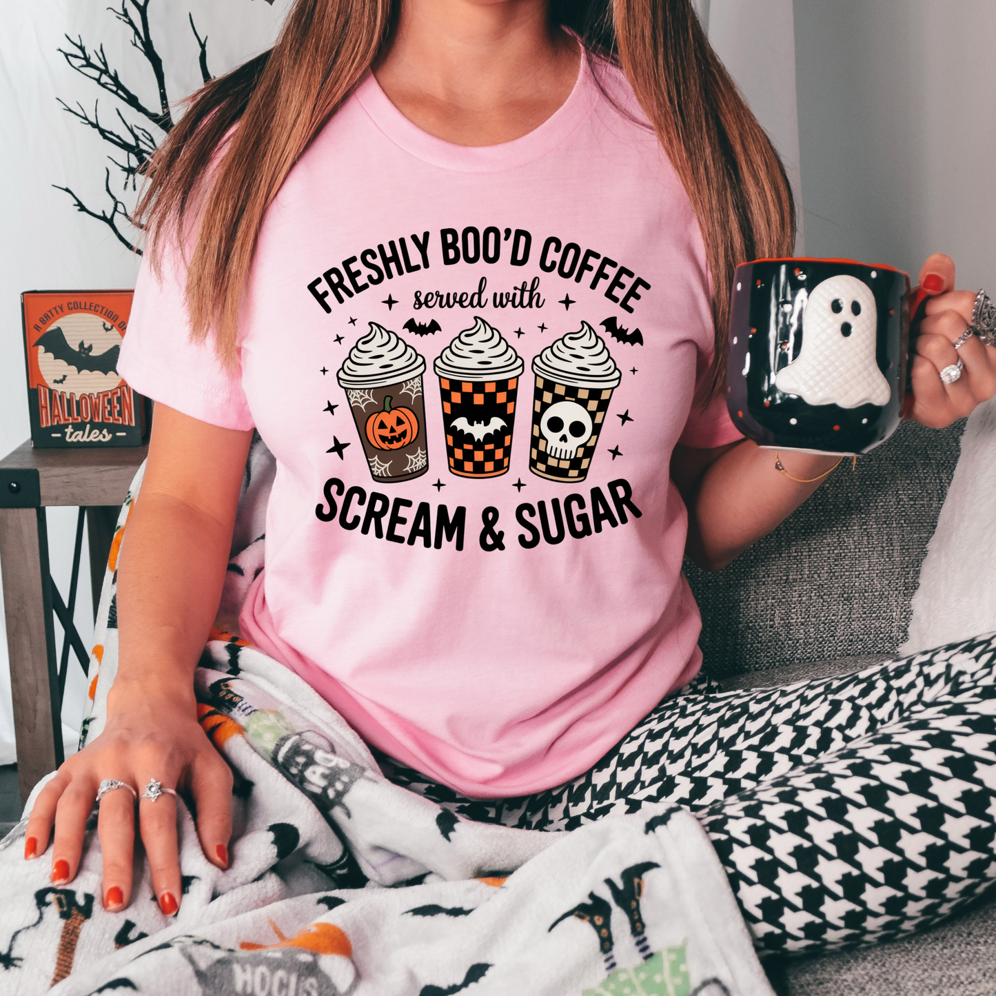 Funny Halloween coffee shirt featuring three festive coffee cups with pumpkins, bats, checkerboard patterns, and skull artwork that reads "Freshly Boo'd Coffee Served With Scream & Sugar." freshly boo'd coffee shirt, scream and sugar shirt, halloween coffee shirt, spooky coffee shirt, coffee lover halloween shirt, pumpkin spice shirt, fall coffee shirt, cute halloween tee, halloween graphic tee, spooky season shirt, pumpkin patch outfit, coffee addict shirt, funny coffee shirt, halloween apparel