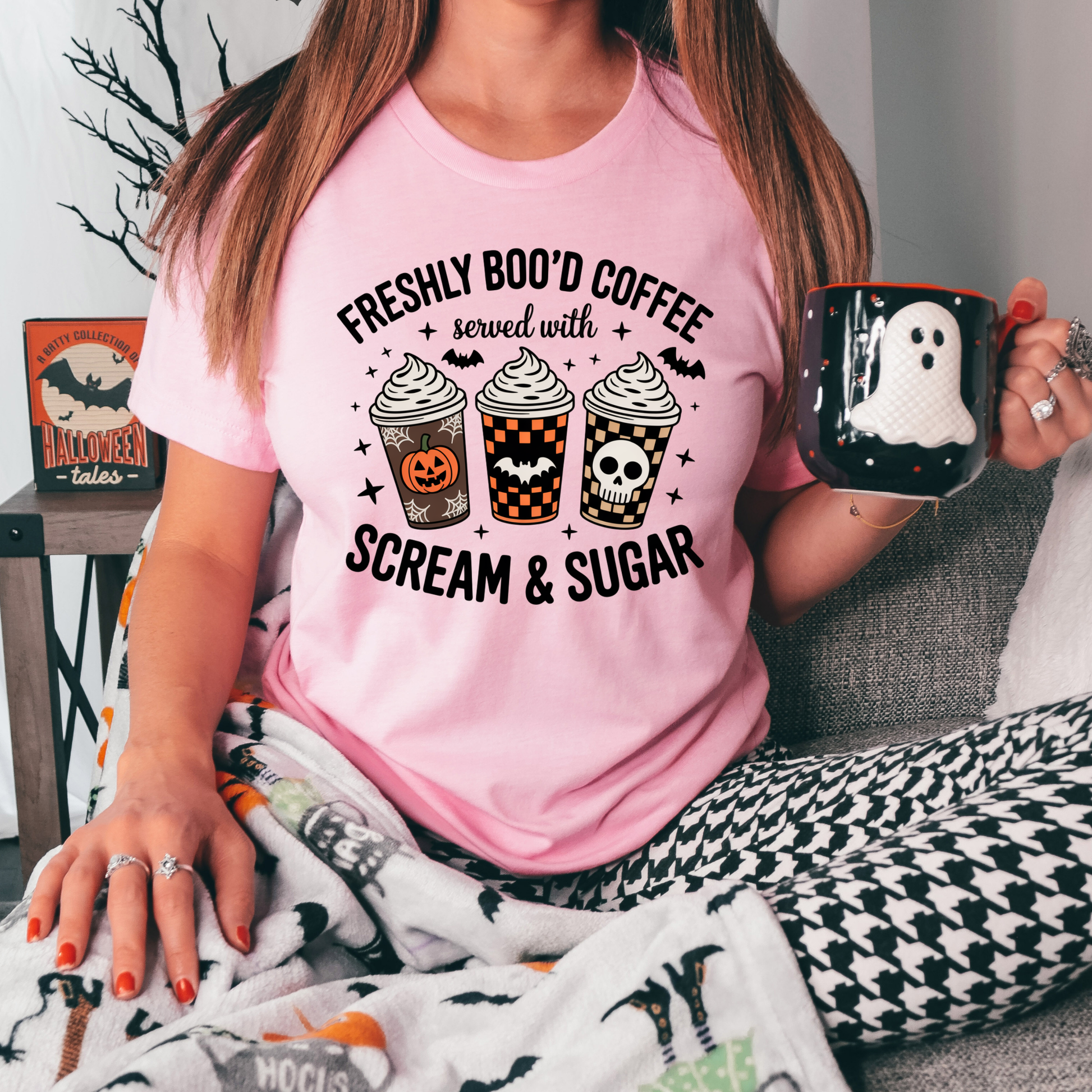 Funny Halloween coffee shirt featuring three festive coffee cups with pumpkins, bats, checkerboard patterns, and skull artwork that reads "Freshly Boo'd Coffee Served With Scream & Sugar." freshly boo'd coffee shirt, scream and sugar shirt, halloween coffee shirt, spooky coffee shirt, coffee lover halloween shirt, pumpkin spice shirt, fall coffee shirt, cute halloween tee, halloween graphic tee, spooky season shirt, pumpkin patch outfit, coffee addict shirt, funny coffee shirt, halloween apparel