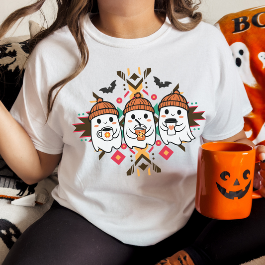 Cute Ghost Floral Coffee Indigenous Halloween shirt featuring three ghosts holding coffee drinks with Indigenous-inspired geometric artwork, bats, and cozy fall colors.