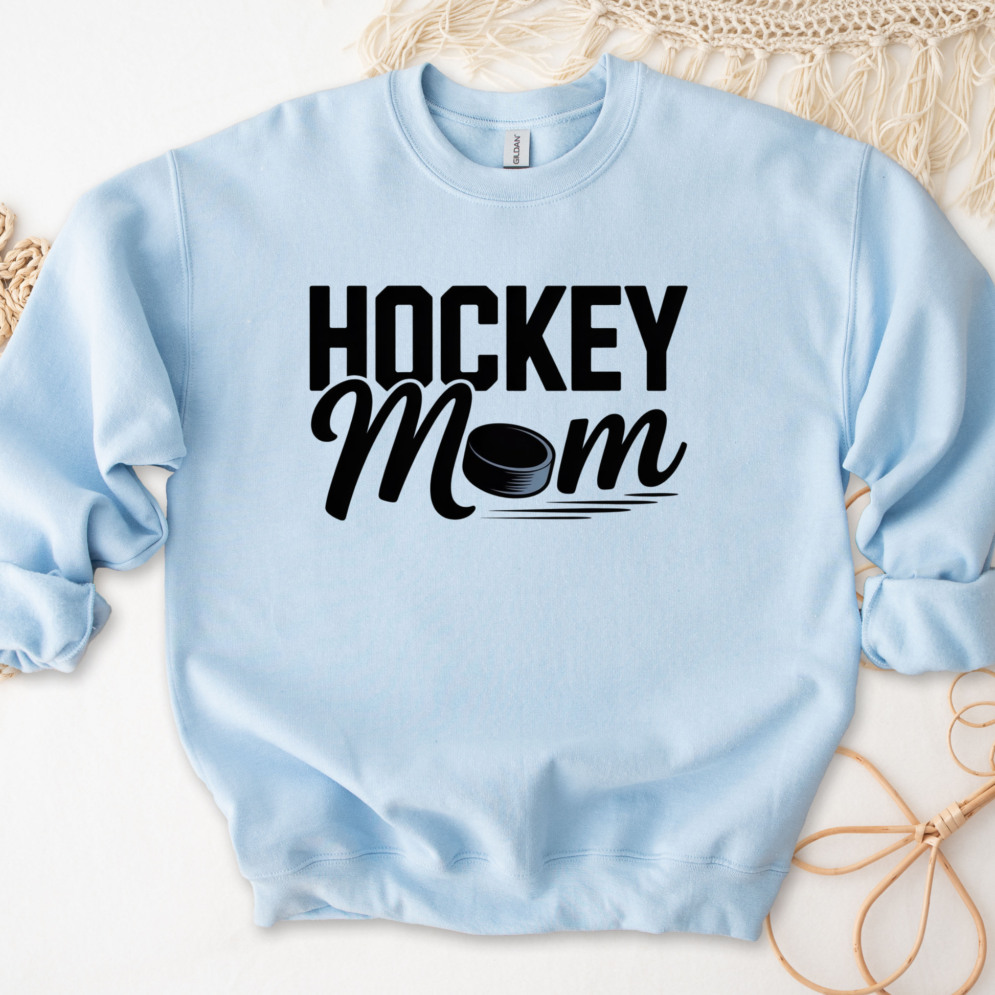 Hockey Mom crewneck sweatshirt with bold hockey-inspired text on a cozy unisex sweatshirt. hockey mom crewneck, hockey mom sweatshirt, hockey parent apparel, sports mom sweatshirt, cozy hockey shirt, hockey family clothing, game day sweatshirt, proud hockey mom, rink side style, unisex crewneck, hockey life apparel, mom gift sweatshirt