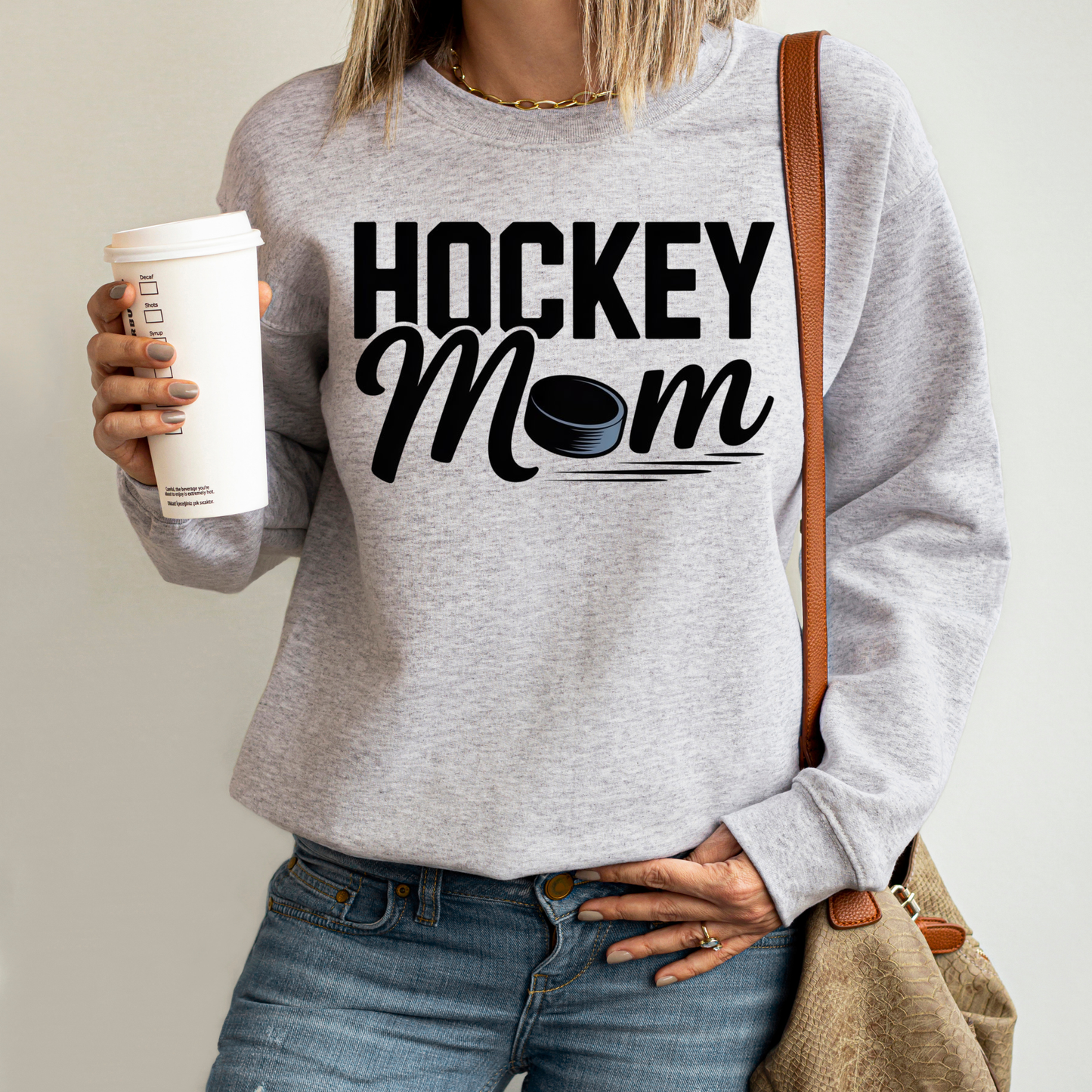 Hockey Mom crewneck sweatshirt with bold hockey-inspired text on a cozy unisex sweatshirt. hockey mom crewneck, hockey mom sweatshirt, hockey parent apparel, sports mom sweatshirt, cozy hockey shirt, hockey family clothing, game day sweatshirt, proud hockey mom, rink side style, unisex crewneck, hockey life apparel, mom gift sweatshirt