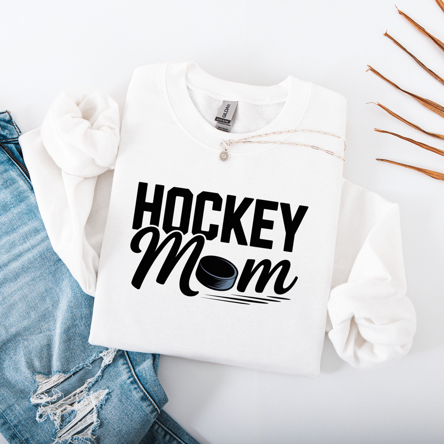 Hockey Mom crewneck sweatshirt with bold hockey-inspired text on a cozy unisex sweatshirt. hockey mom crewneck, hockey mom sweatshirt, hockey parent apparel, sports mom sweatshirt, cozy hockey shirt, hockey family clothing, game day sweatshirt, proud hockey mom, rink side style, unisex crewneck, hockey life apparel, mom gift sweatshirt