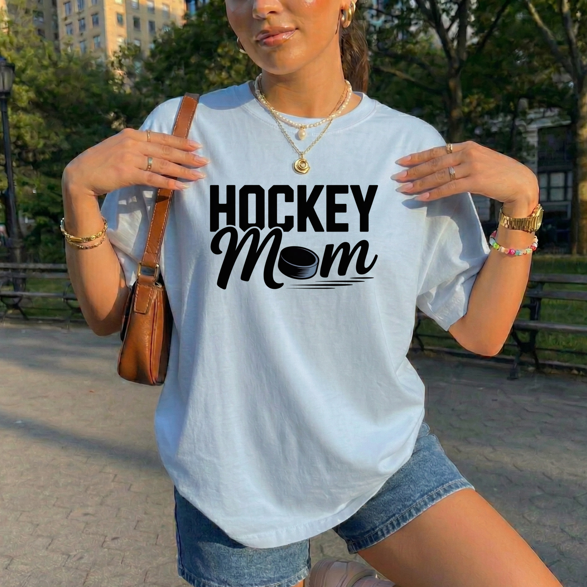 Hockey Mom shirt with a hockey puck graphic on a unisex graphic tee. hockey mom shirt, hockey parent tee, sports mom shirt, unisex graphic tee, hockey fan apparel, game day shirt, hockey life shirt, funny mom shirt, puck shirt, tournament shirt, practice shirt, mom gift tee, hockey family apparel, everyday casual tee, proud hockey mom