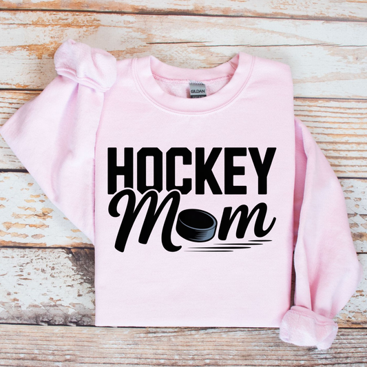 Hockey Mom crewneck sweatshirt with bold hockey-inspired text on a cozy unisex sweatshirt. hockey mom crewneck, hockey mom sweatshirt, hockey parent apparel, sports mom sweatshirt, cozy hockey shirt, hockey family clothing, game day sweatshirt, proud hockey mom, rink side style, unisex crewneck, hockey life apparel, mom gift sweatshirt