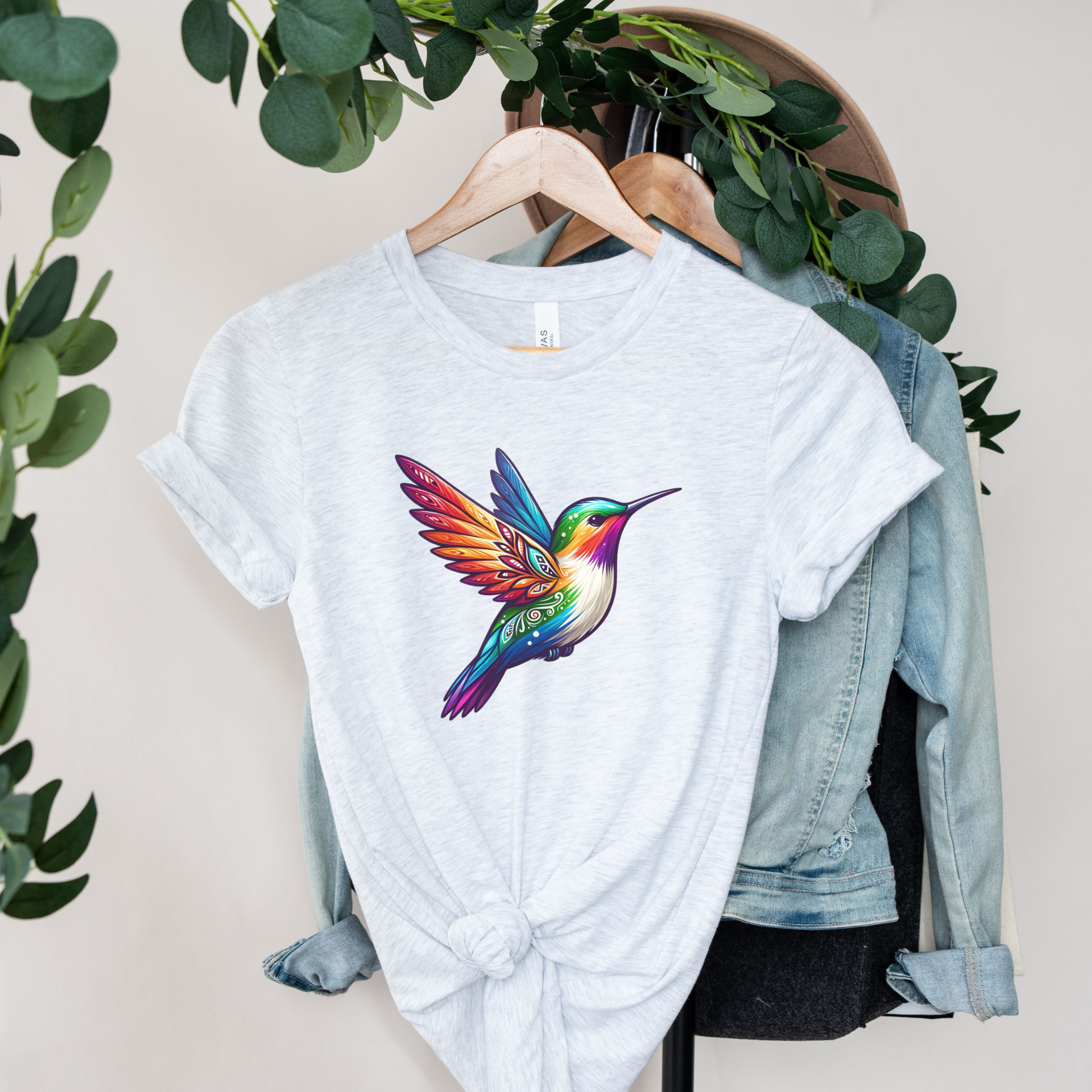 Colourful Indigenous Pride hummingbird design on t-shirt featuring rainbow feathers and Indigenous-inspired artwork. Indigenous Pride Shirt, Indigenous Hummingbird Shirt, LGBTQ2S+ Indigenous Apparel, Pride Hummingbird Tee, Indigenous Clothing Canada, Rainbow Hummingbird Shirt, Indigenous Designed Apparel, Native Pride Shirt, Indigenous LGBTQ Shirt