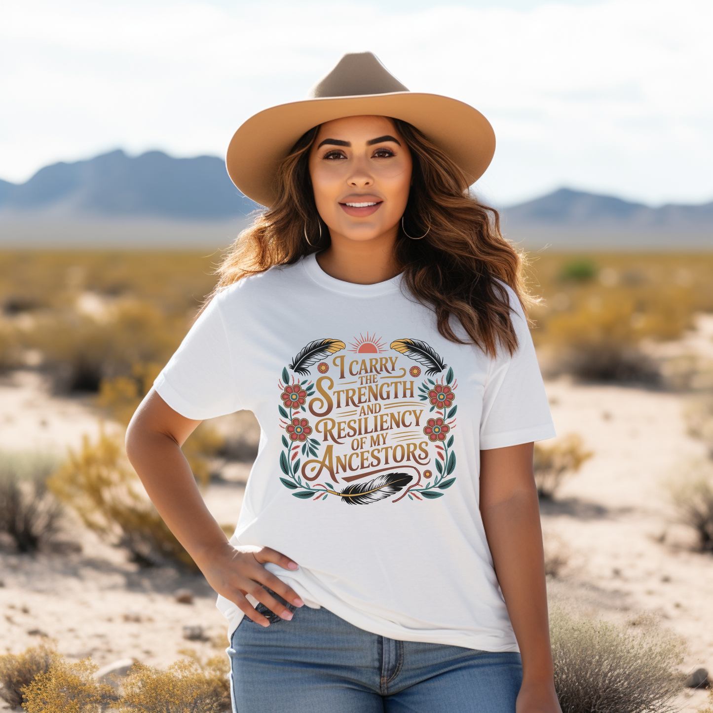Woman wearing a white t-shirt with a design in a desert setting indigenous shirt, ancestor strength shirt, resiliency shirt, indigenous inspired apparel, meaningful t shirts, strength quote shirt, heritage shirt, empowerment shirt, cultural awareness clothing, statement t shirt, social justice apparel, unity shirt, inspirational shirt, ally shirt, conscious fashion