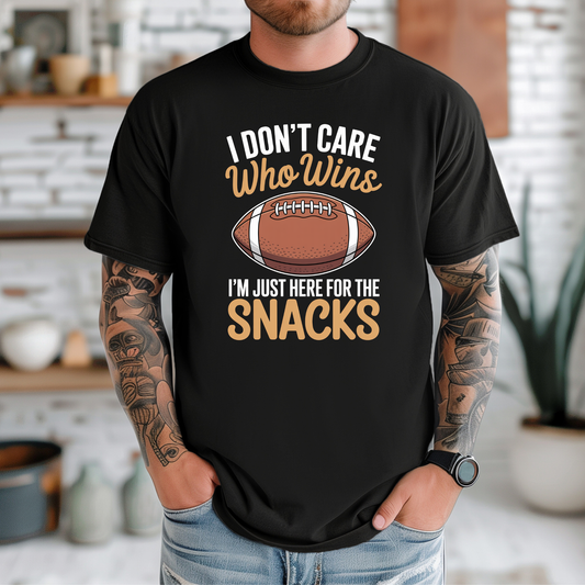 funny football shirt, game day shirt, snack lover shirt, super bowl party tee, I don’t care who wins shirt, here for the snacks shirt, football fan t-shirt, tailgate outfit, big game shirt, casual sports fan tee, humorous graphic tee, unisex game day top, football party clothing, lazy fan shirt, game day snacks shirt