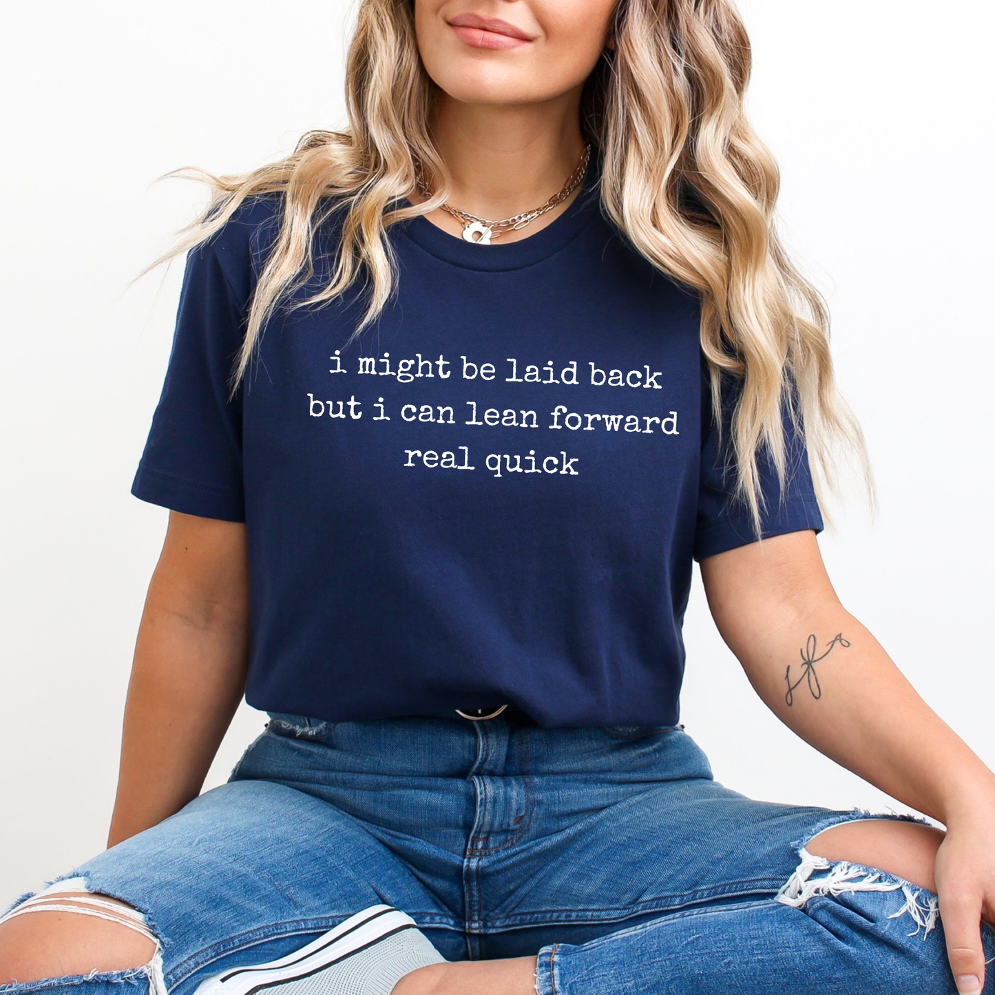 navy t-shirt with a humorous text quote, I might be laid back but I can lean forward real quick shirt, sassy attitude t-shirt, funny motivational tee, unisex humor graphic shirt, quick reaction t-shirt, chill vibe attitude tee, bold typography casual shirt, gym motivation shirt, sarcastic everyday tee, indigenous owned funny shirt, laid back strength apparel, real quick response graphic