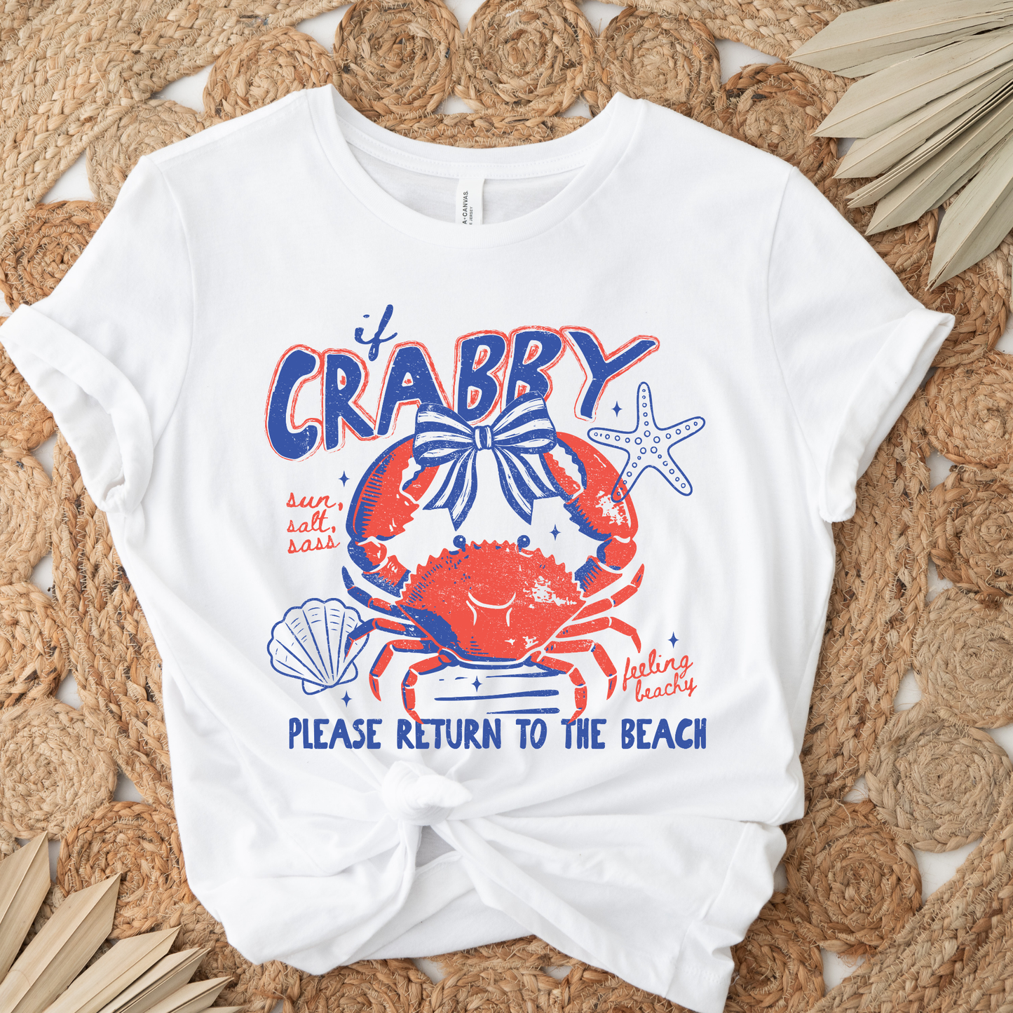 White t-shirt with a colorful crab graphic and text on a woven mat background beach shirt, coastal tee, funny beach shirt, beach vacation outfit, summer shirt, ocean lover gift, seaside apparel, crab shirt, vacation t-shirt, casual beachwear, coastal clothing, lake life shirt, beach humor tee, seaside gifts, unisex beach shirt